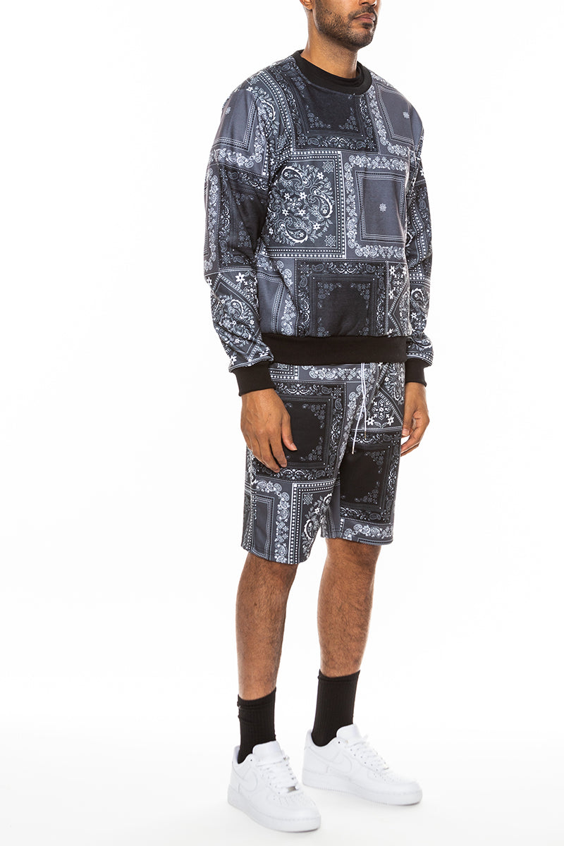 A stylish paisley all over print crew set featuring a round neck, ribbed collar, and cuffs, with front and back pockets.