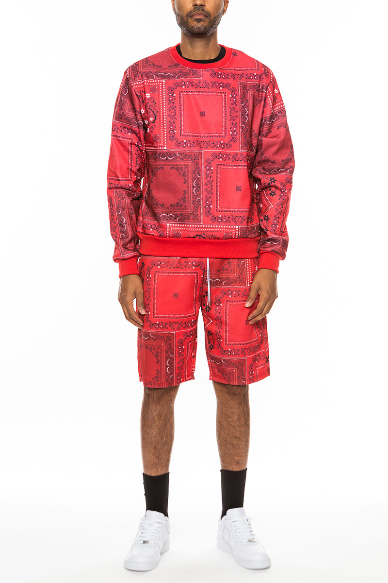 A stylish paisley all over print crew set featuring a round neck, ribbed collar, and cuffs, with front and back pockets.