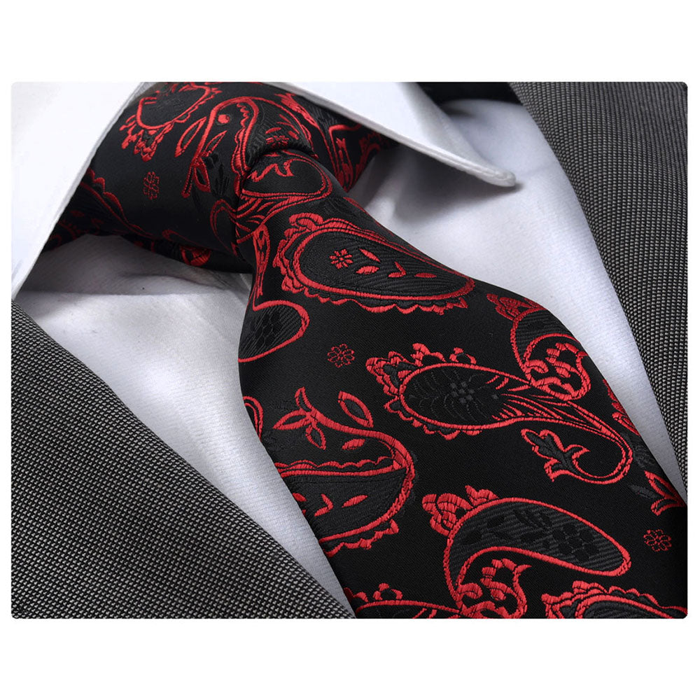 Red Black Paisley Mens Designer Silk Necktie elegantly displayed in a gift box, showcasing its luxurious fabric and intricate design.
