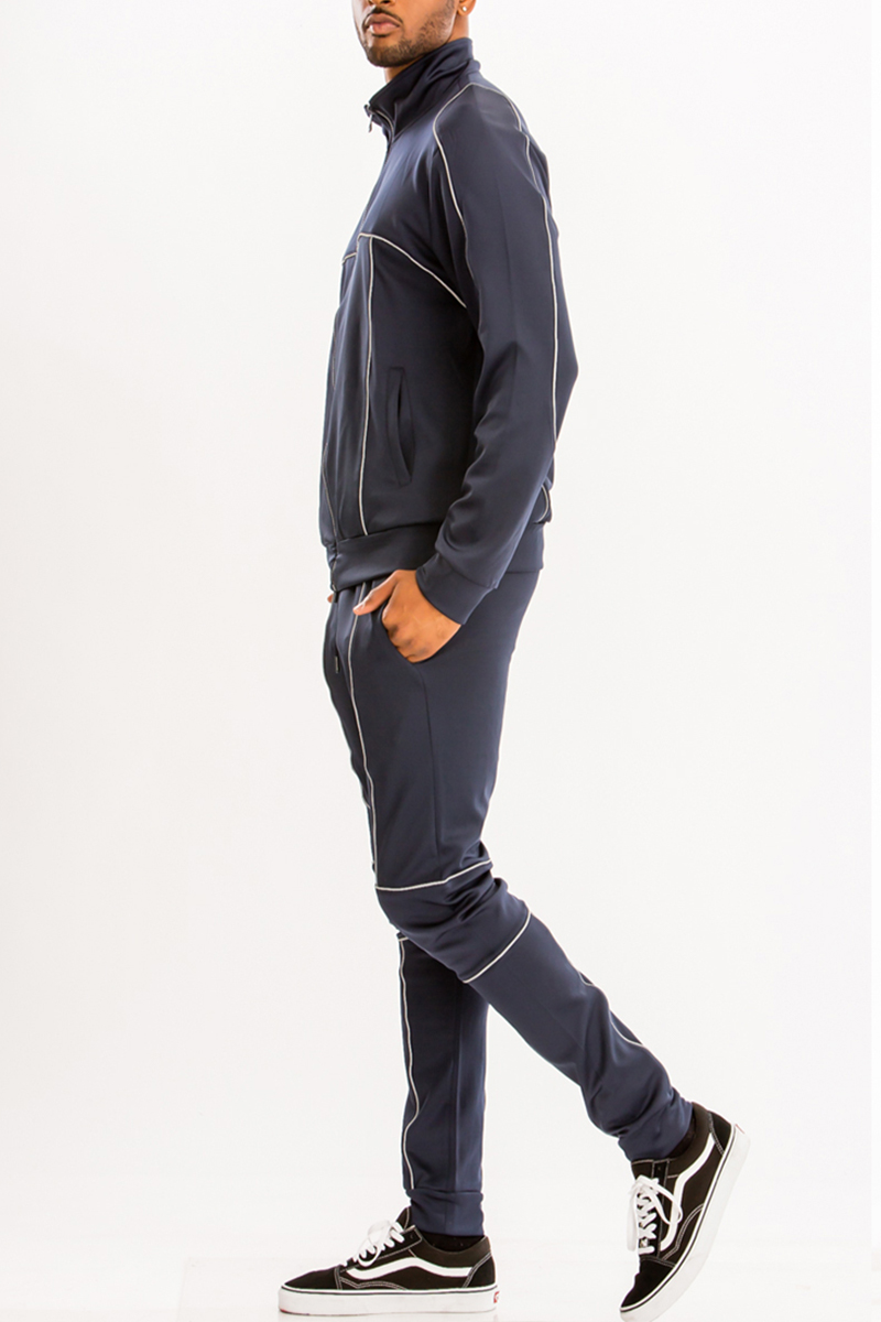 Reflective Piping Detailed Track Suit featuring a full zip jacket, elastic waist, and standard pockets, made from polyester and spandex.