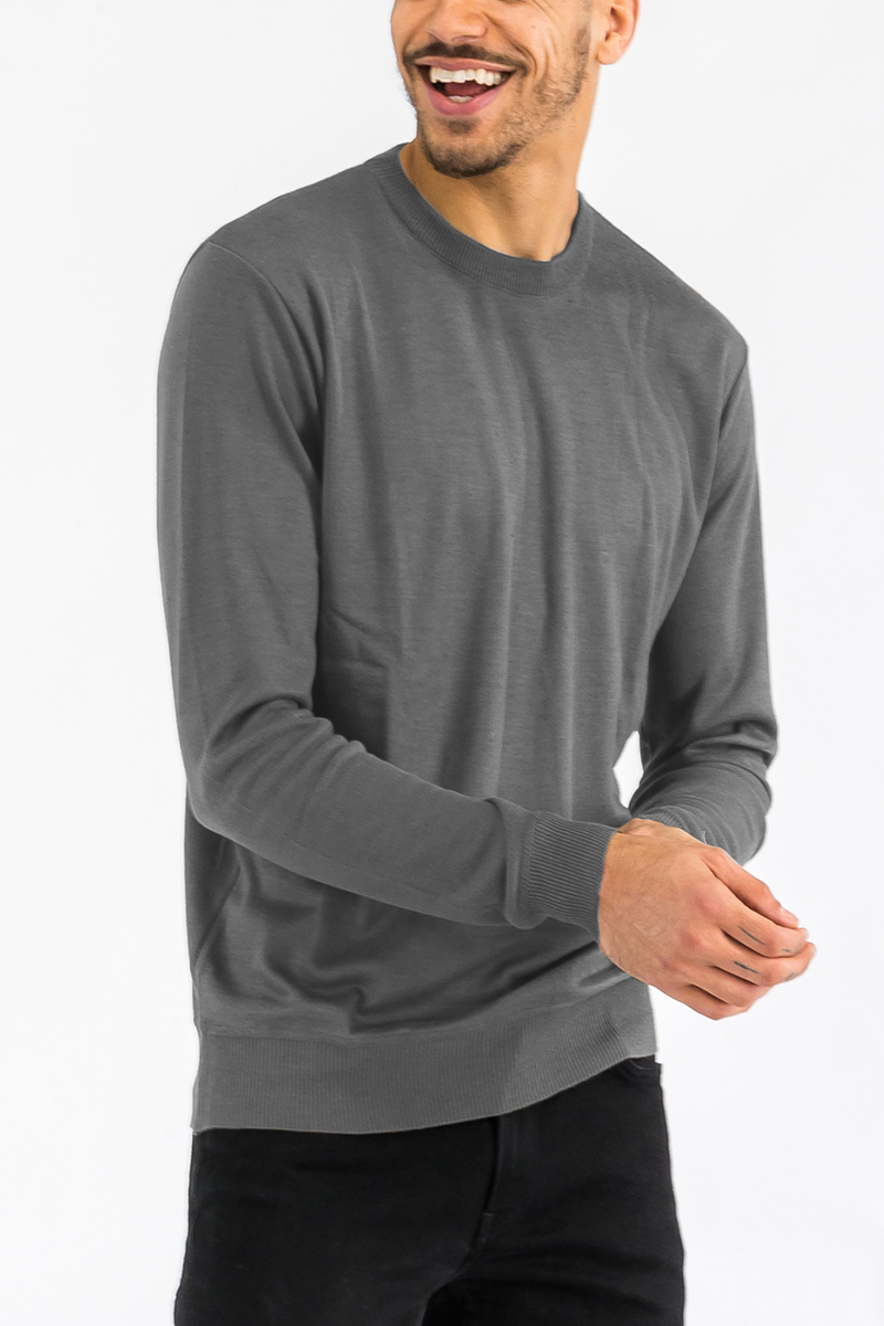 A cozy round neck knit sweater in a classic design, made from 100% polyester, perfect for casual and stylish outfits.