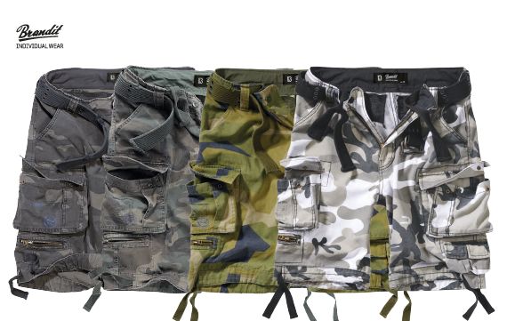 Savage Vintage Cargo Shorts in a rugged outdoor setting, showcasing large side pockets and decorative belt with eyelets.