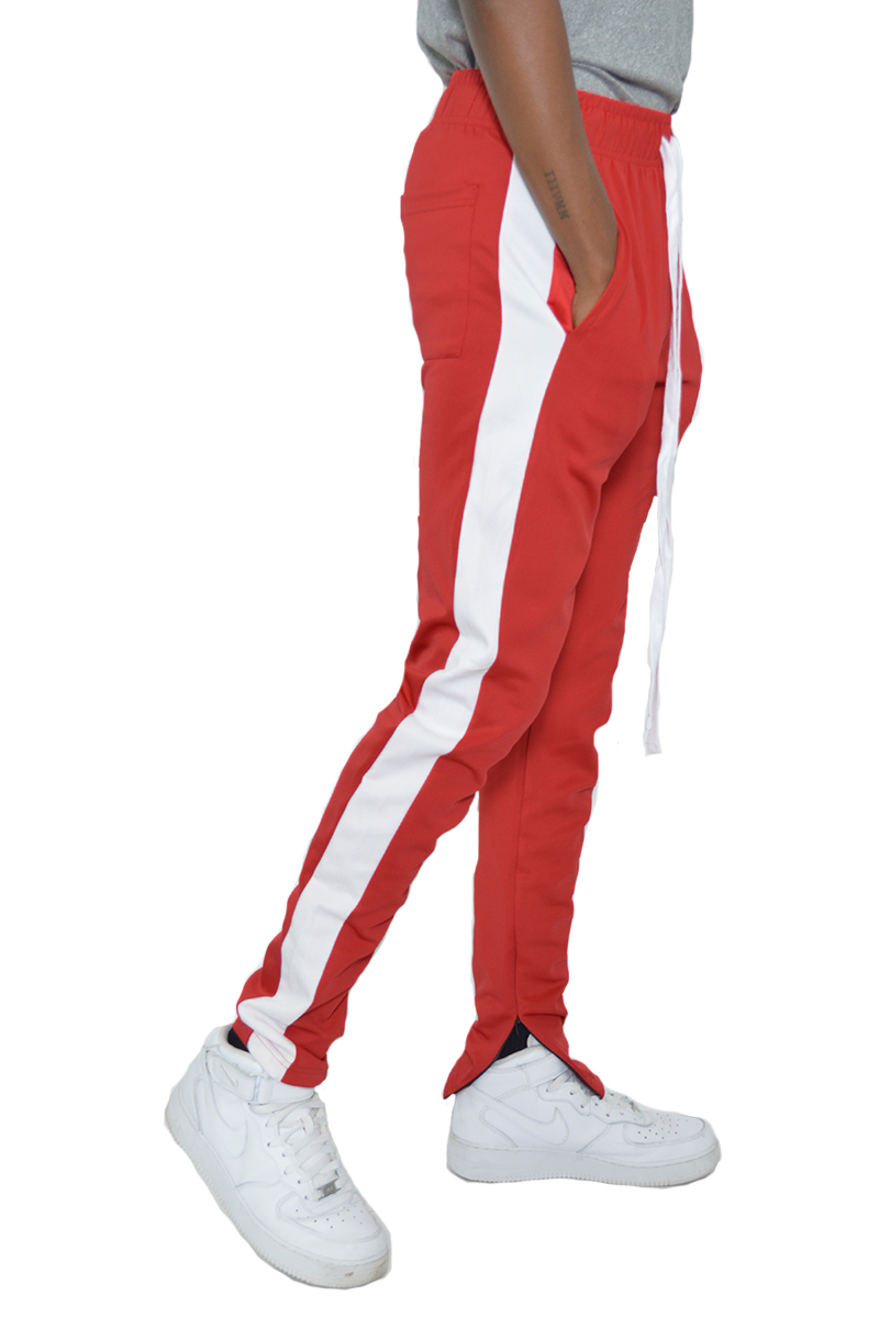 A pair of sleek slim fit track pants featuring a single stripe detail and hidden ankle zippers, perfect for athletic and casual wear.
