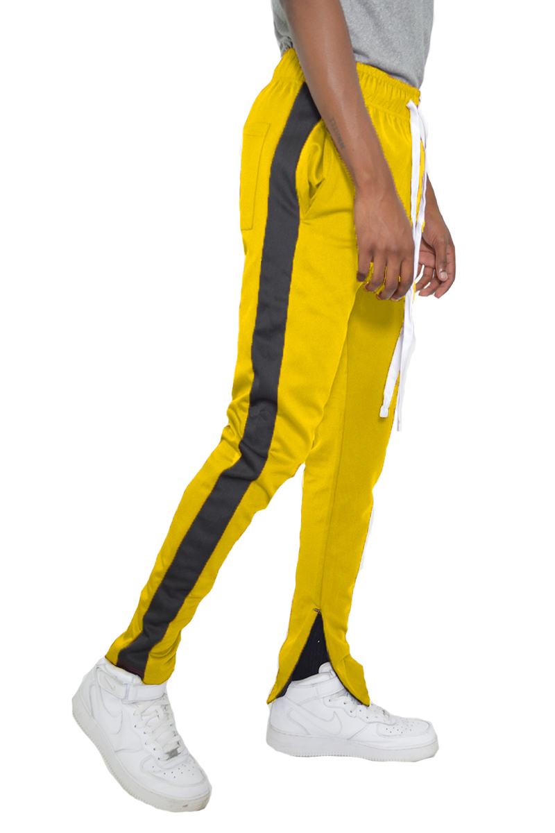 A pair of stylish slim fit track pants featuring a single stripe detail and hidden ankle zipper, perfect for workouts and casual wear.