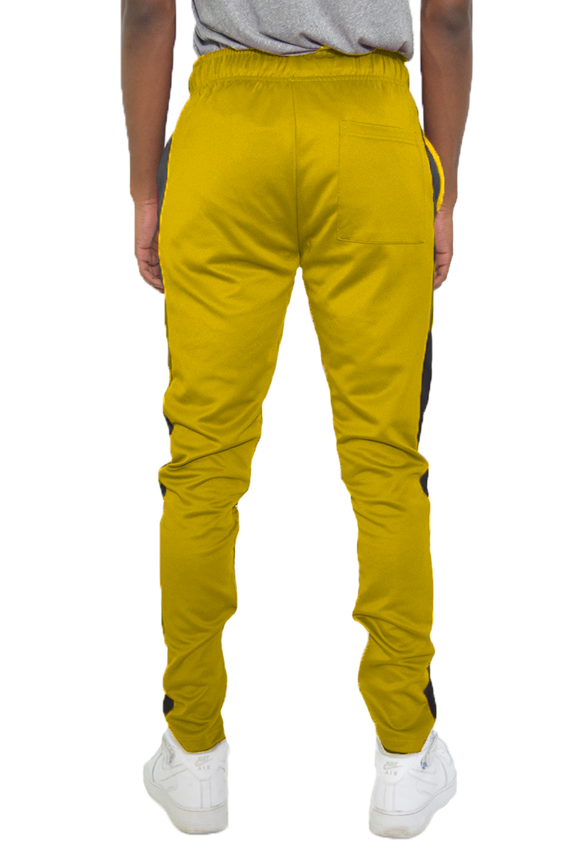 A pair of stylish slim fit track pants featuring a single stripe detail and hidden ankle zipper, perfect for workouts and casual wear.