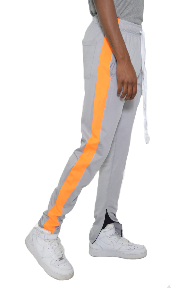 A pair of stylish slim fit track pants featuring a single stripe detail and hidden ankle zippers, perfect for workouts and casual wear.