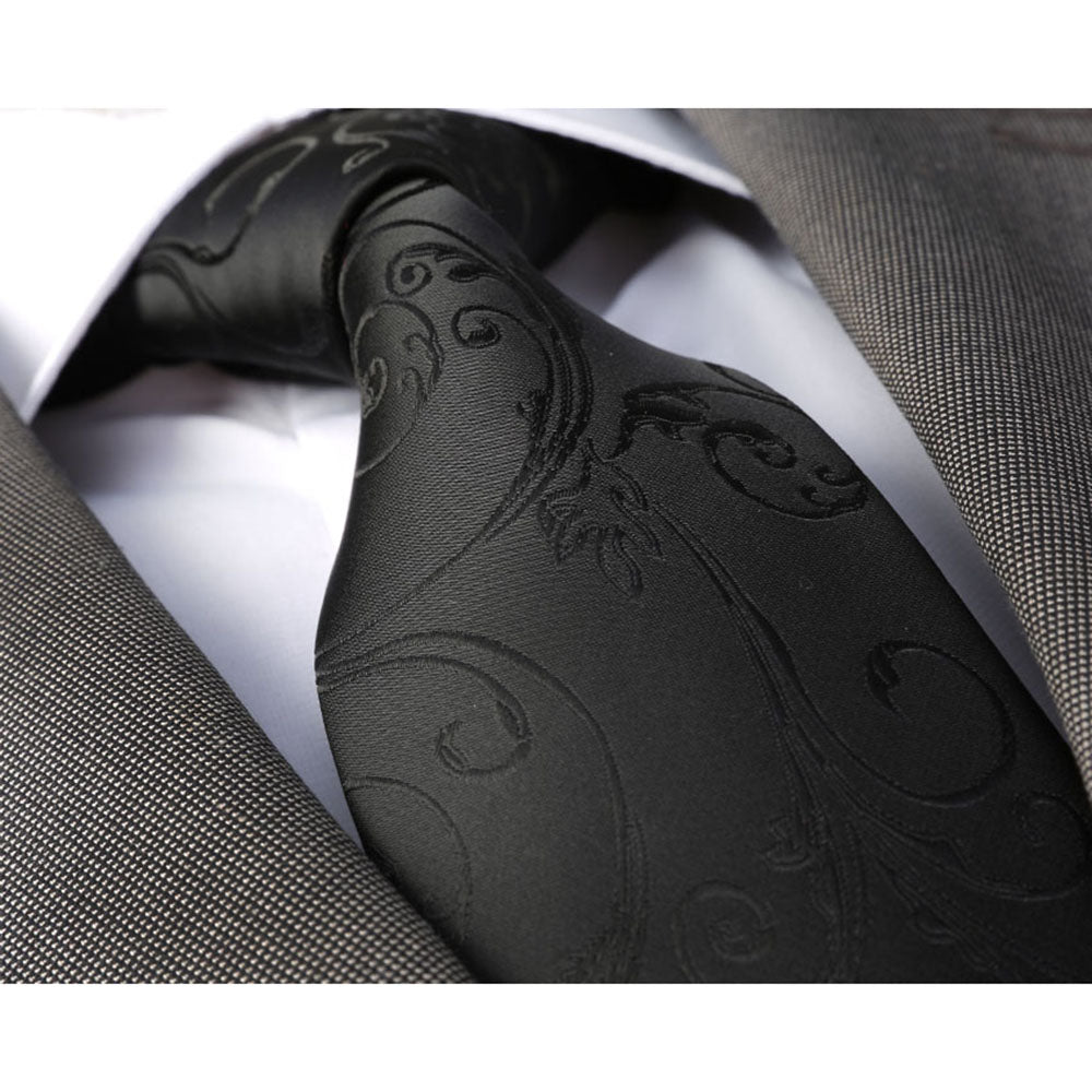 Solid Black Paisley Mens Designer Silk Necktie displayed elegantly in a gift box, showcasing its luxurious fabric and intricate design.