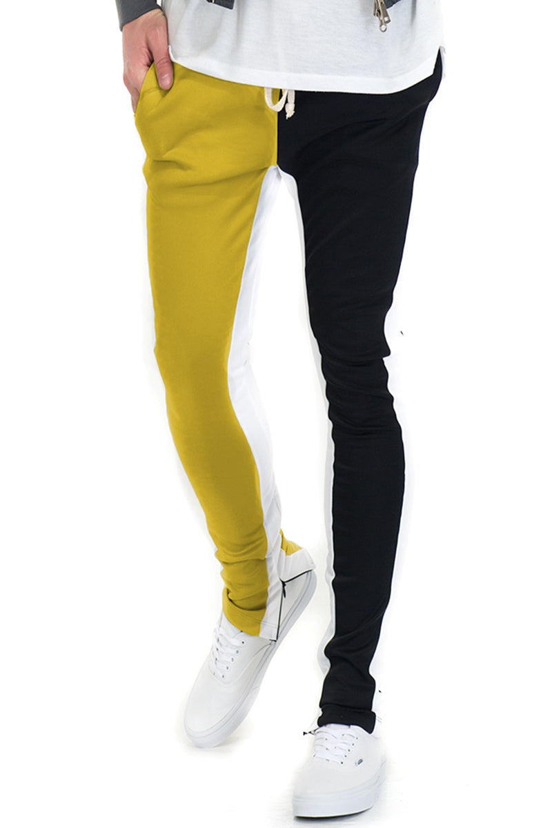 A pair of stylish Split Tone Track Pants featuring a two-tone design with a single side stripe and ankle zippers, perfect for casual wear.