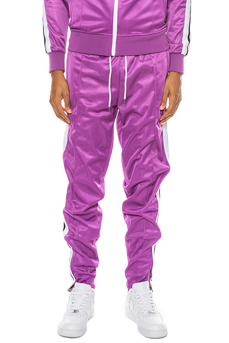 A pair of stylish striped tape track pants made from 100% polyester, featuring an elastic waist, drawstring, ankle zippers, and multiple pockets.