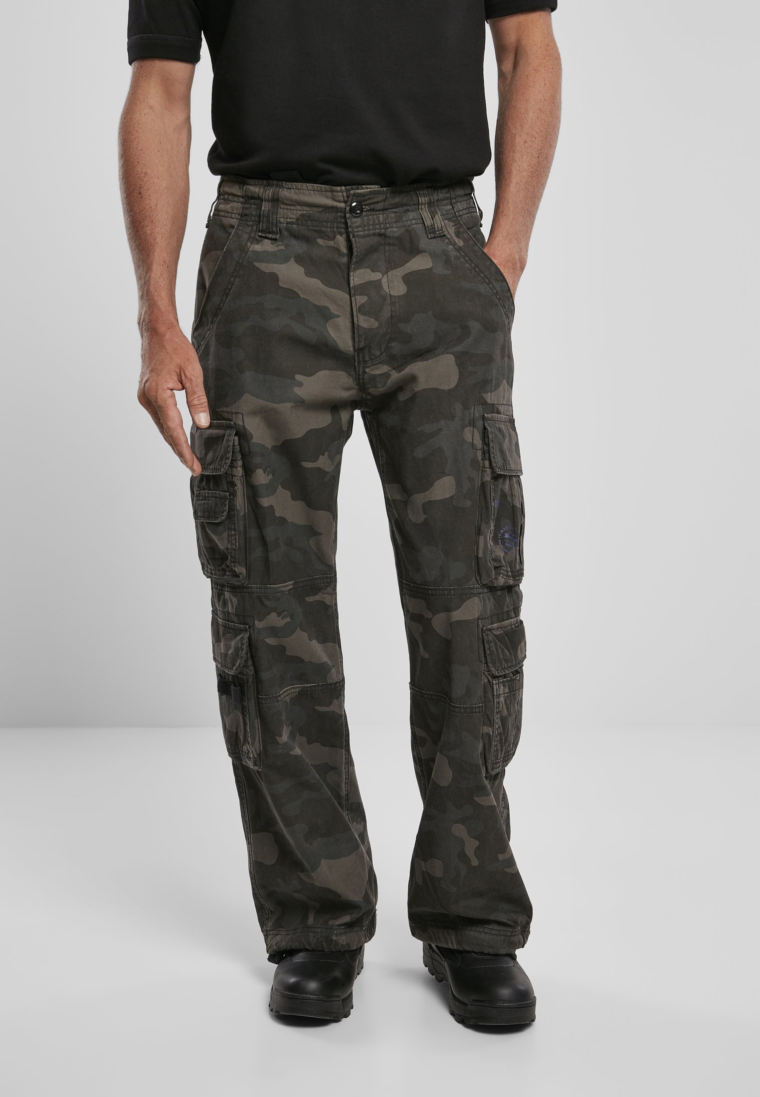 A pair of Vintage Cargo Pants in various colors, featuring spacious side pockets and adjustable drawstrings at the leg ends.