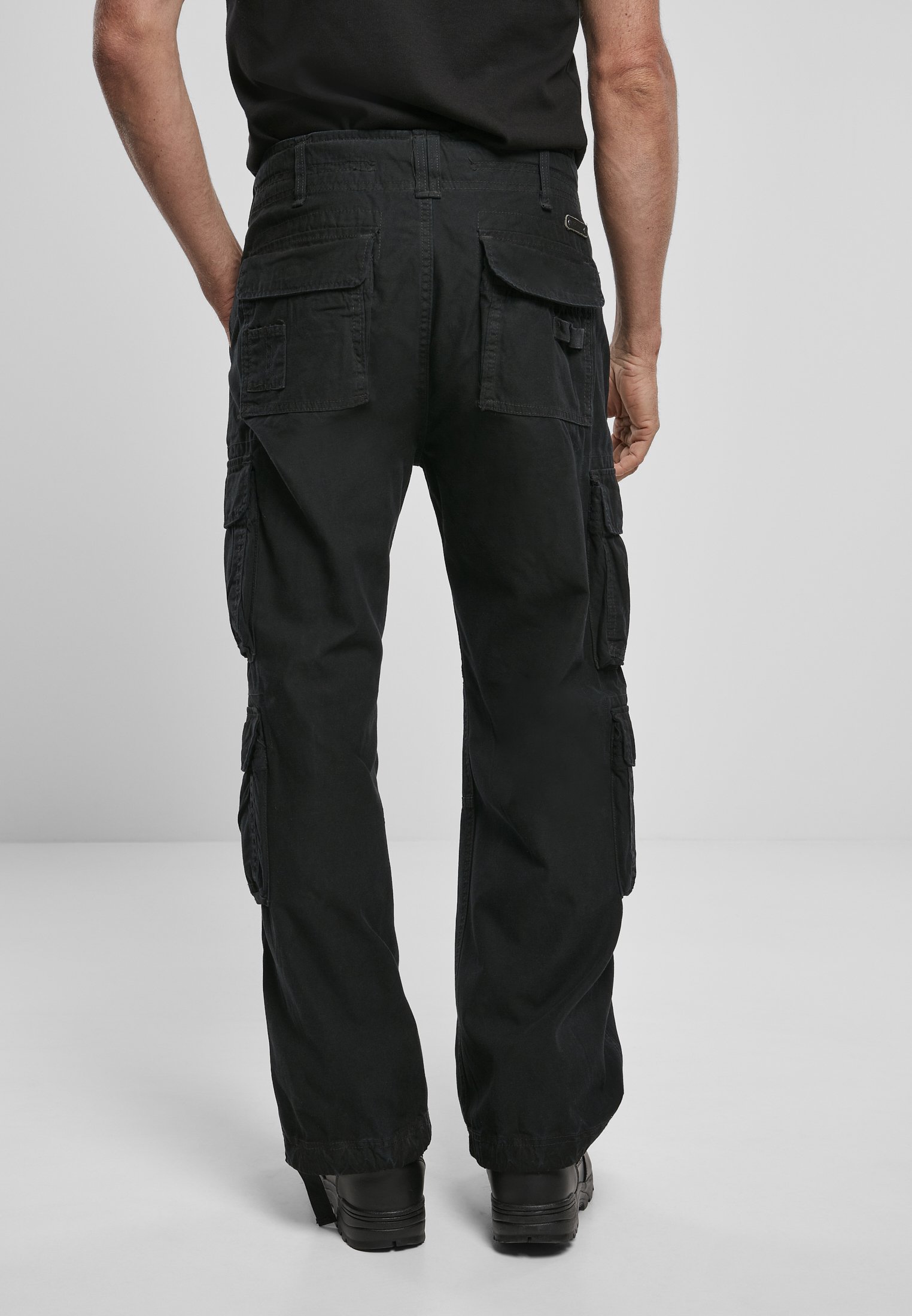 A pair of Vintage Cargo Pants in various colors, featuring spacious side pockets and adjustable drawstrings at the leg ends.