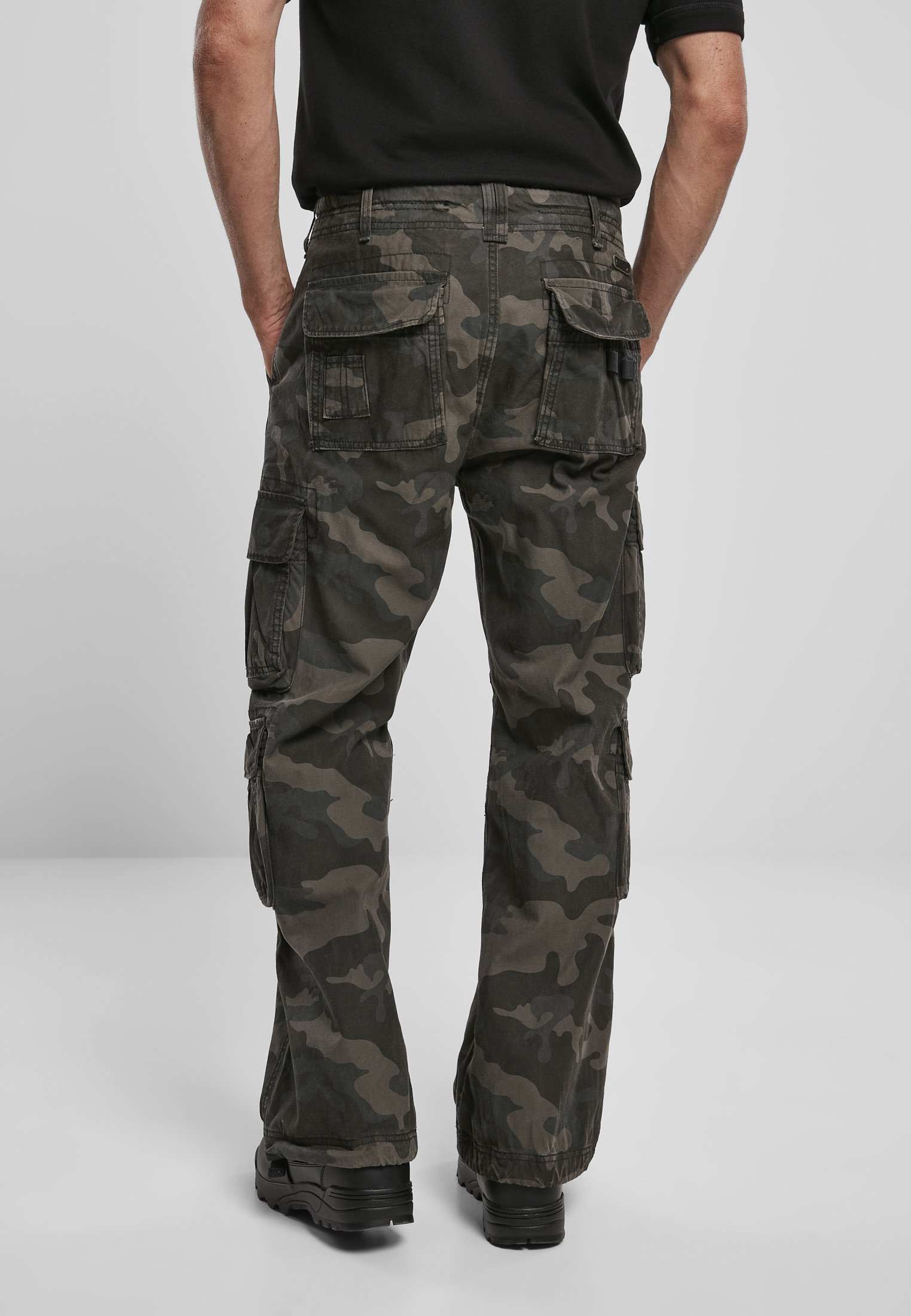 A pair of Vintage Cargo Pants in various colors, featuring spacious side pockets and adjustable drawstrings at the leg ends.