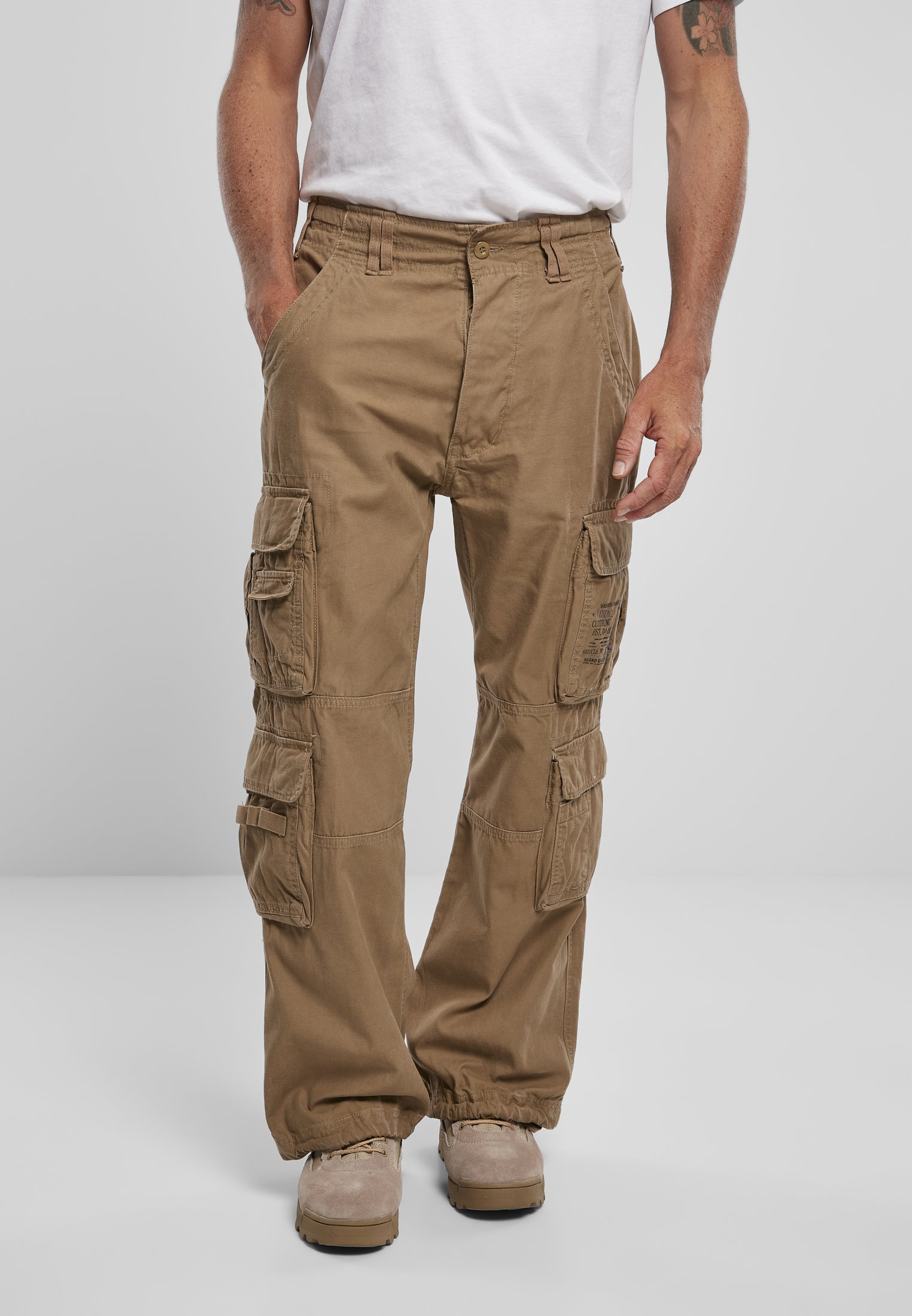 A pair of Vintage Cargo Pants in various colors, featuring spacious side pockets and adjustable drawstrings at the leg ends.