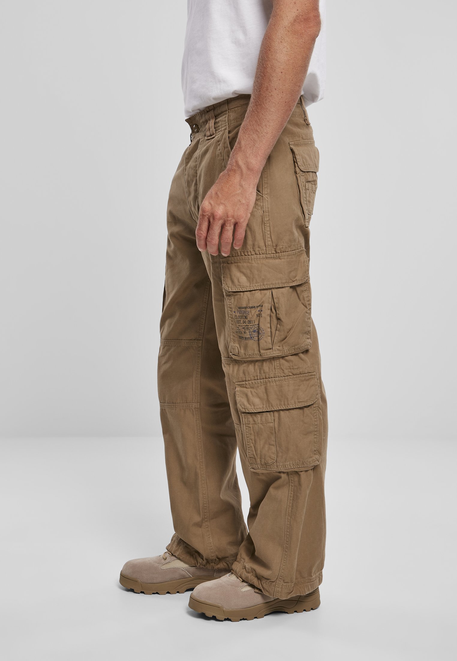A pair of Vintage Cargo Pants in various colors, featuring spacious side pockets and adjustable drawstrings at the leg ends.