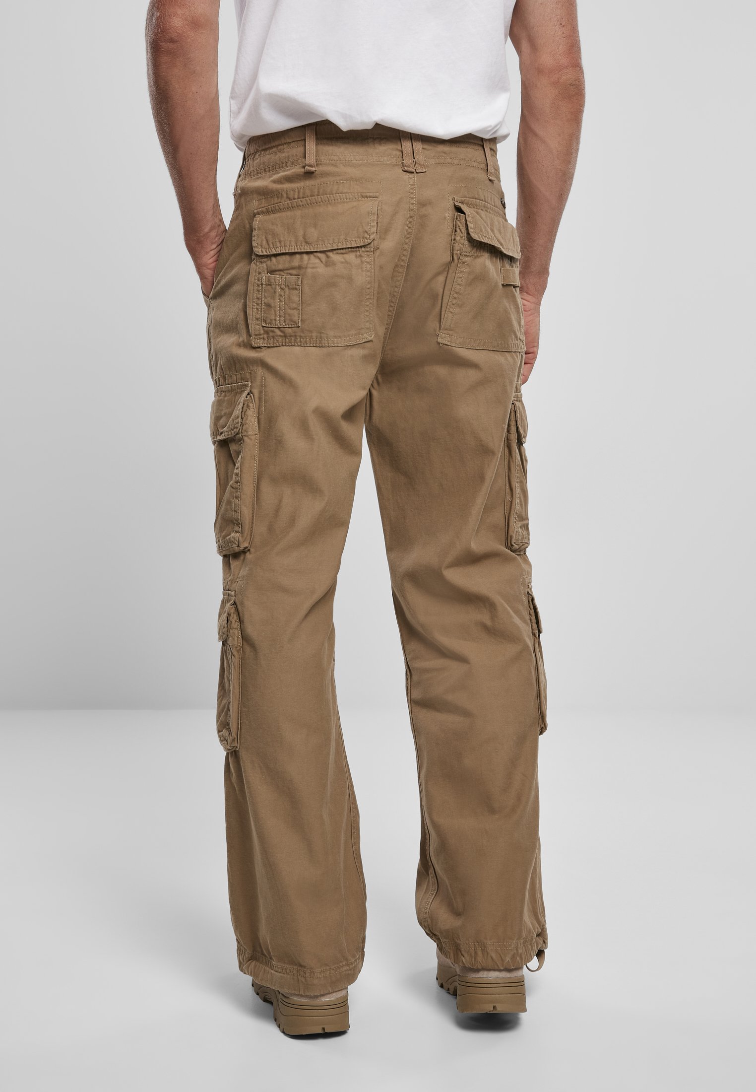 A pair of Vintage Cargo Pants in various colors, featuring spacious side pockets and adjustable drawstrings at the leg ends.