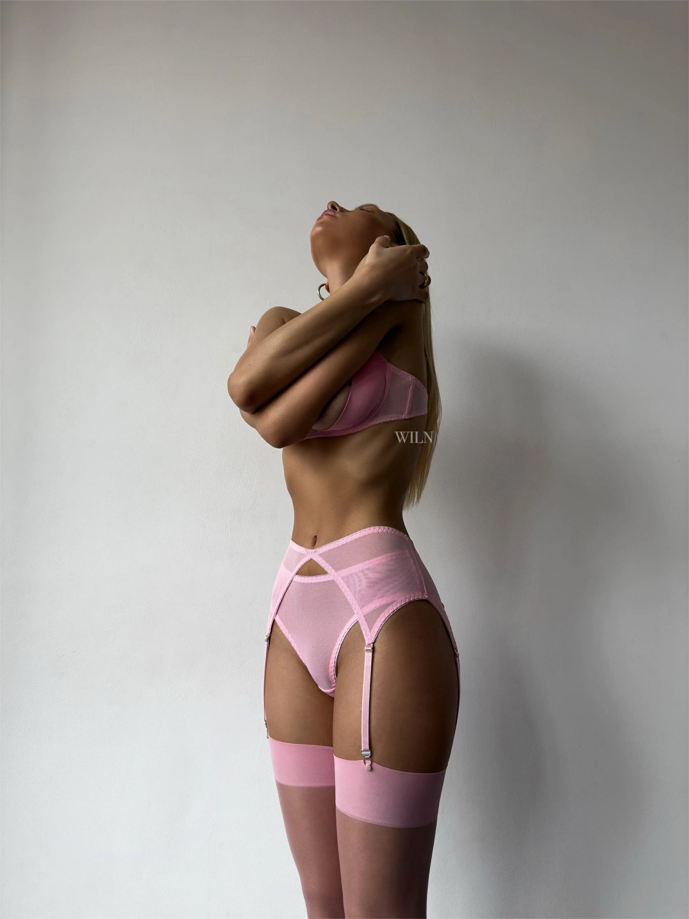 BARBIE 4 Piece Lingerie Set featuring soft mesh, underwired bralet, suspender belt, matching briefs, and sheer pink stockings.