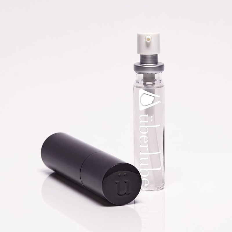 Elegant black refillable case with 15ml silicone-based lubricant insert, designed for discreet travel and intimate moments.