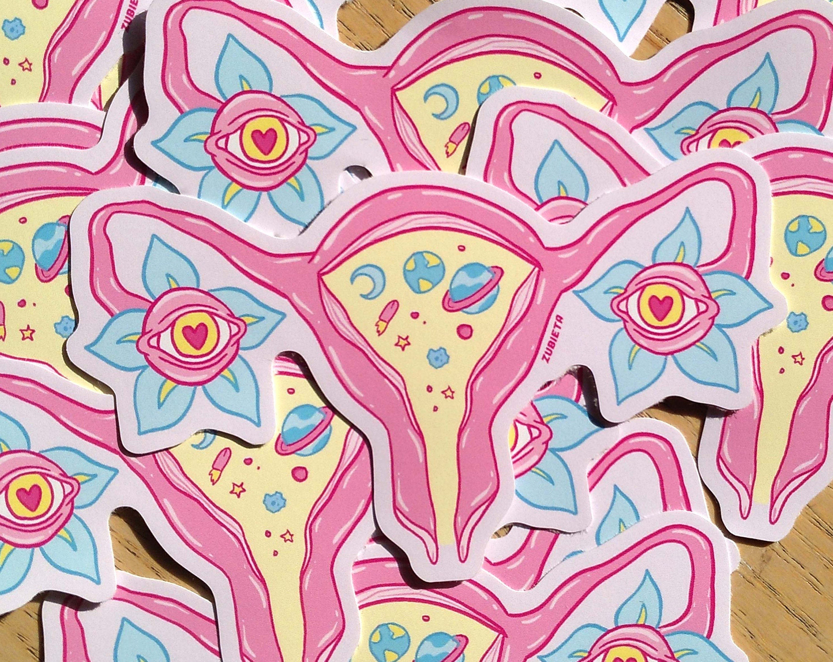 A vibrant Cosmic Uterus Sticker featuring intricate designs, perfect for personalizing laptops, notebooks, and cars.