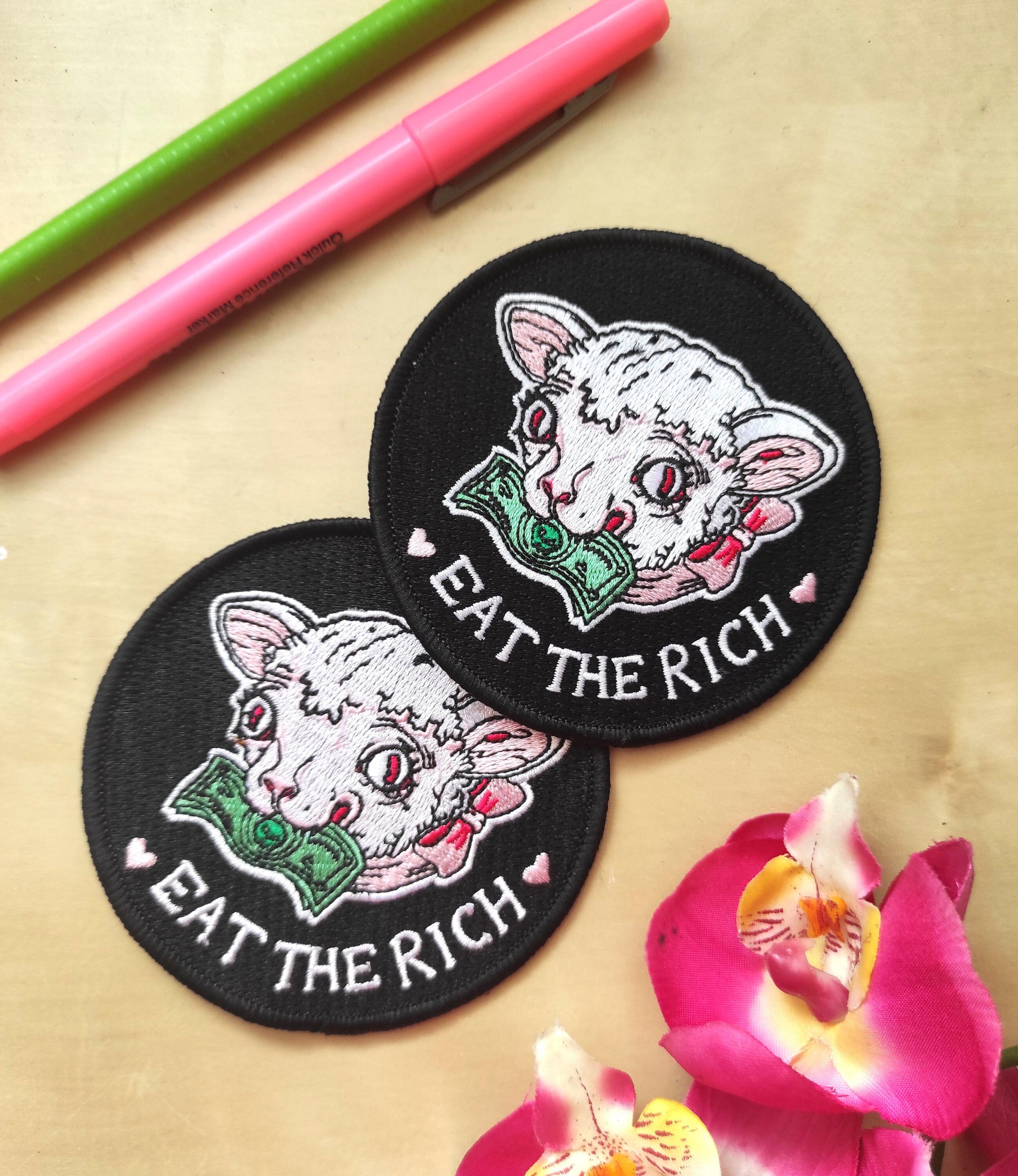 Eat the Rich Embroidered Patch featuring a Rousseau-inspired design in six vibrant colors, measuring 10cm x 10cm.