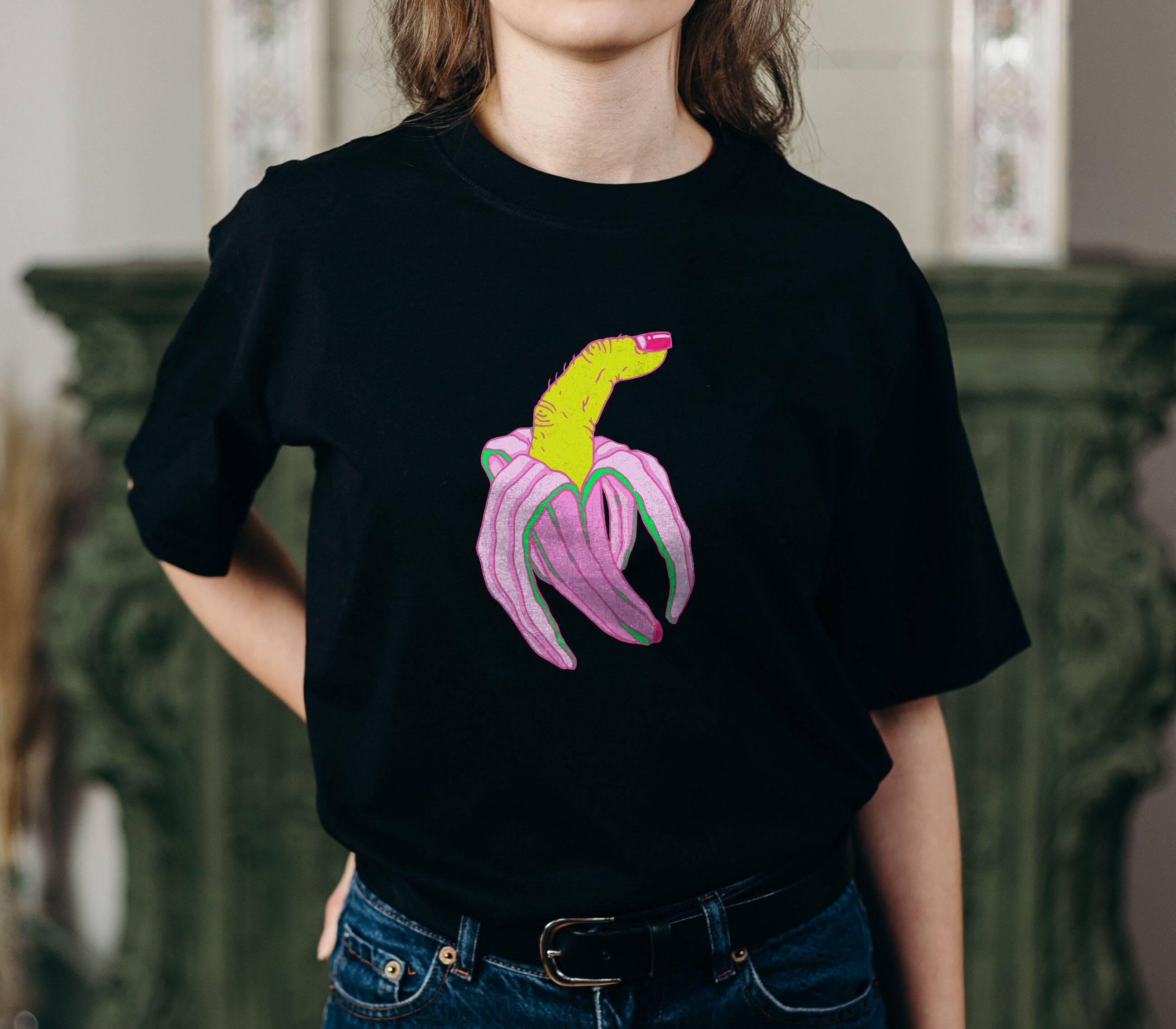 Finger Banana T-shirt featuring the Bananarama 7000 design, made from 100% organic cotton, displayed on a model.