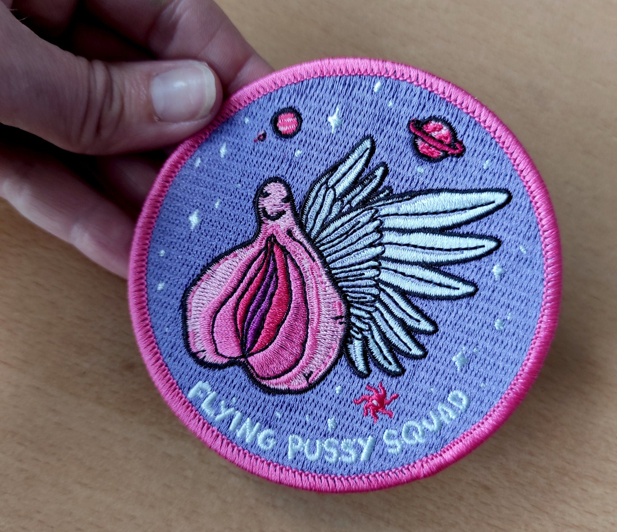 Flying Pussy Squad Embroidered Patch featuring psychedelic design in six colors, measuring 12.5cm x 12.5cm.