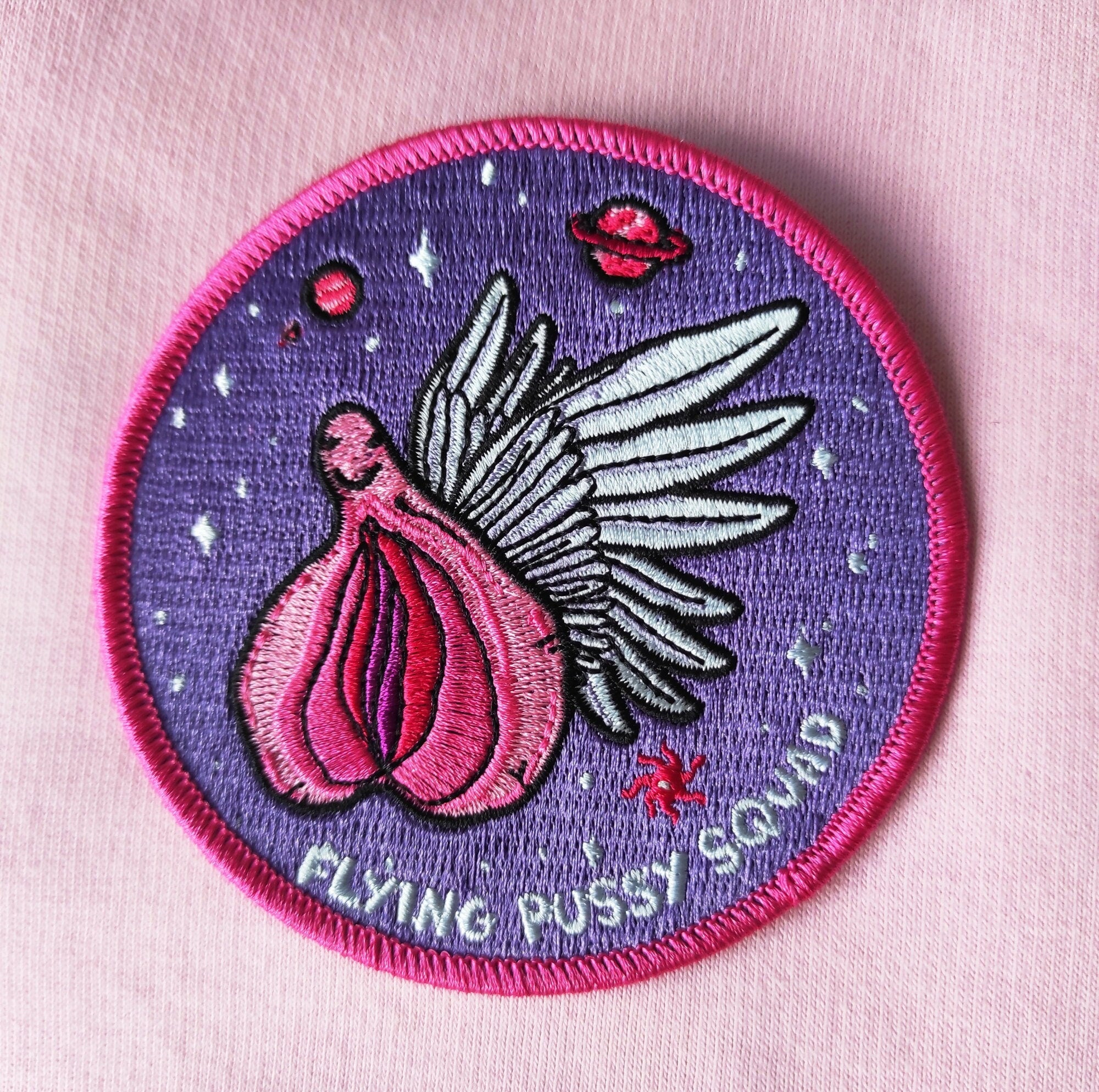 Flying Pussy Squad Embroidered Patch featuring psychedelic design in six colors, measuring 12.5cm x 12.5cm.
