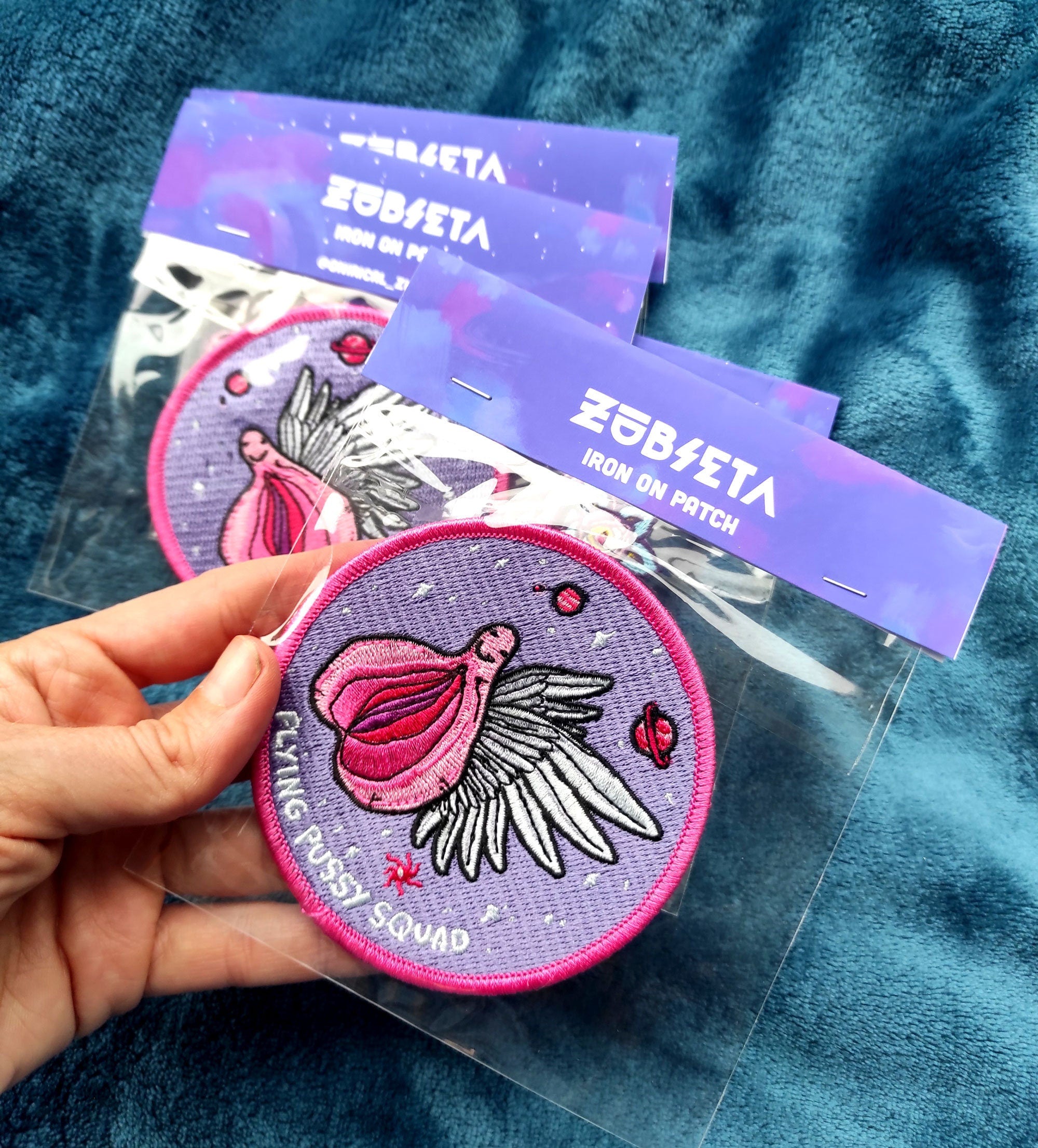 Flying Pussy Squad Embroidered Patch featuring psychedelic design in six colors, measuring 12.5cm x 12.5cm.