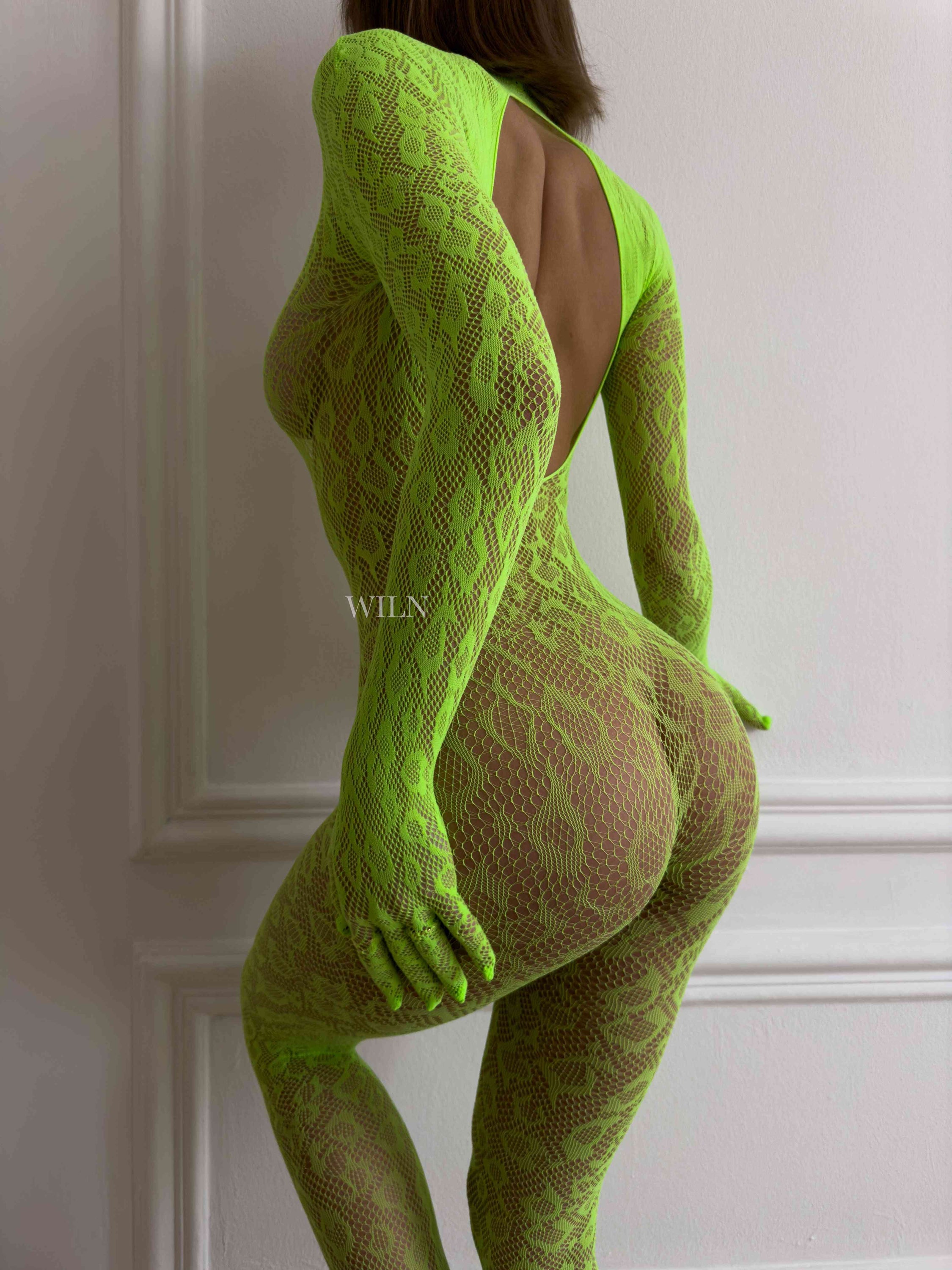 LIBIDO NEON Bodysuit in vibrant colors, showcasing a flattering fishnet design that contours to the body.