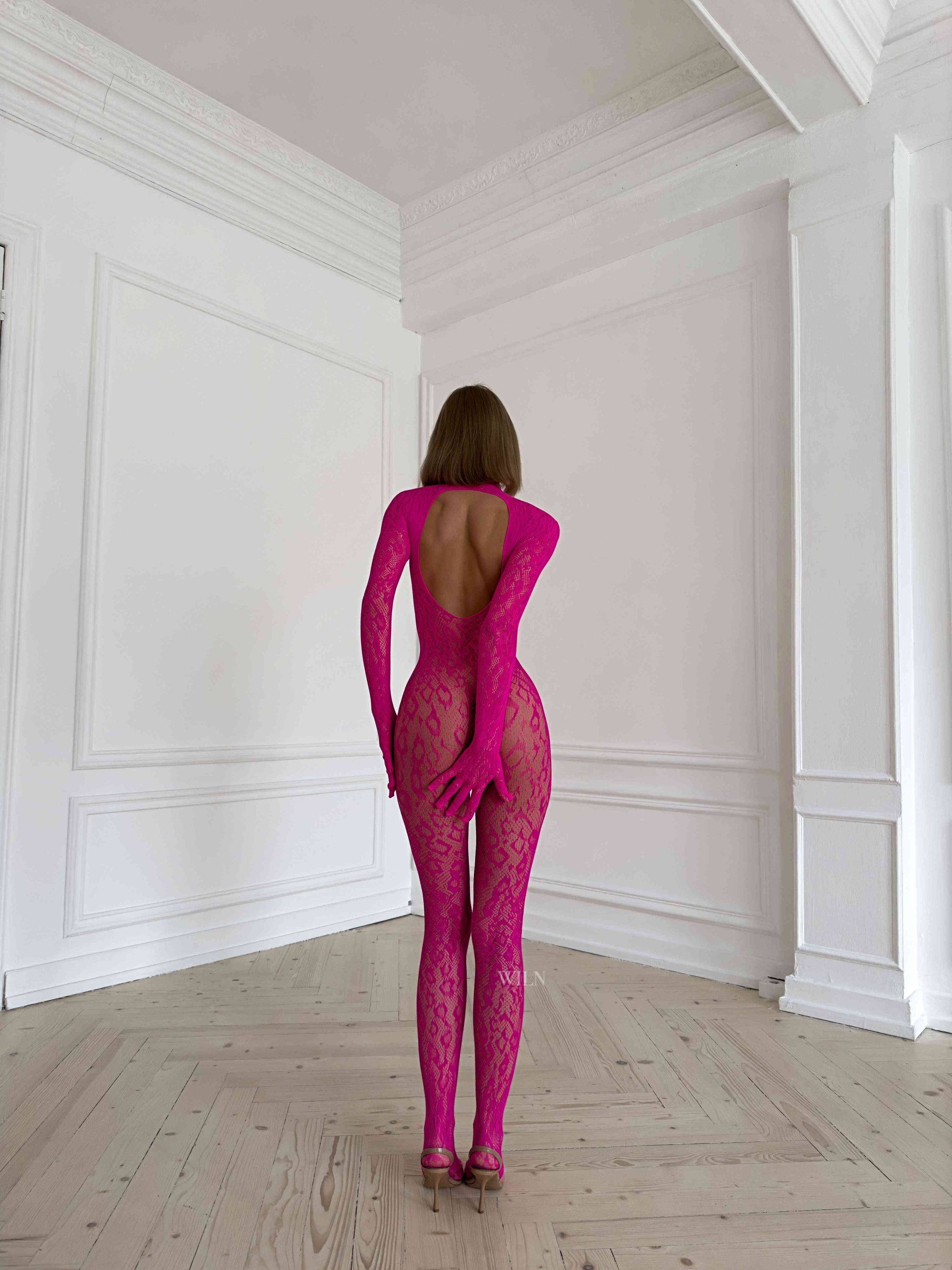 LIBIDO PINK Bodysuit featuring a flattering fishnet design, available in vibrant colors, perfect for enhancing curves.