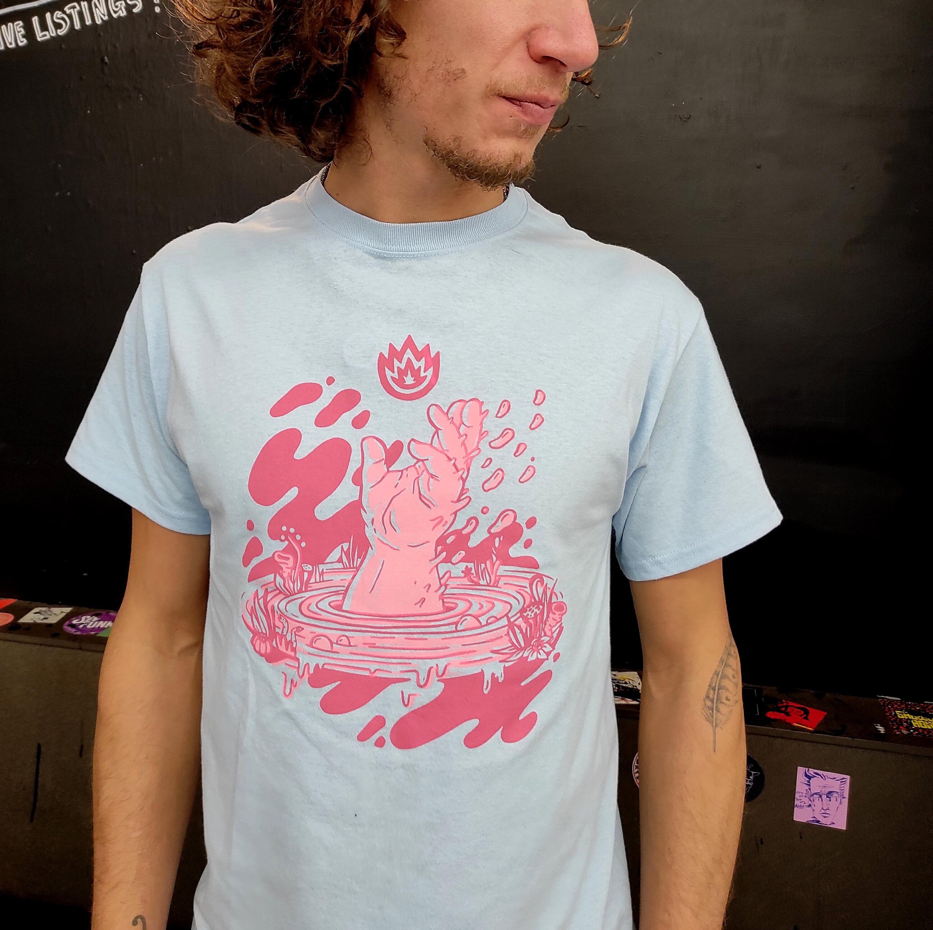 Limited edition We Came From The Water screen print t-shirt in baby blue with artistic front and back designs.