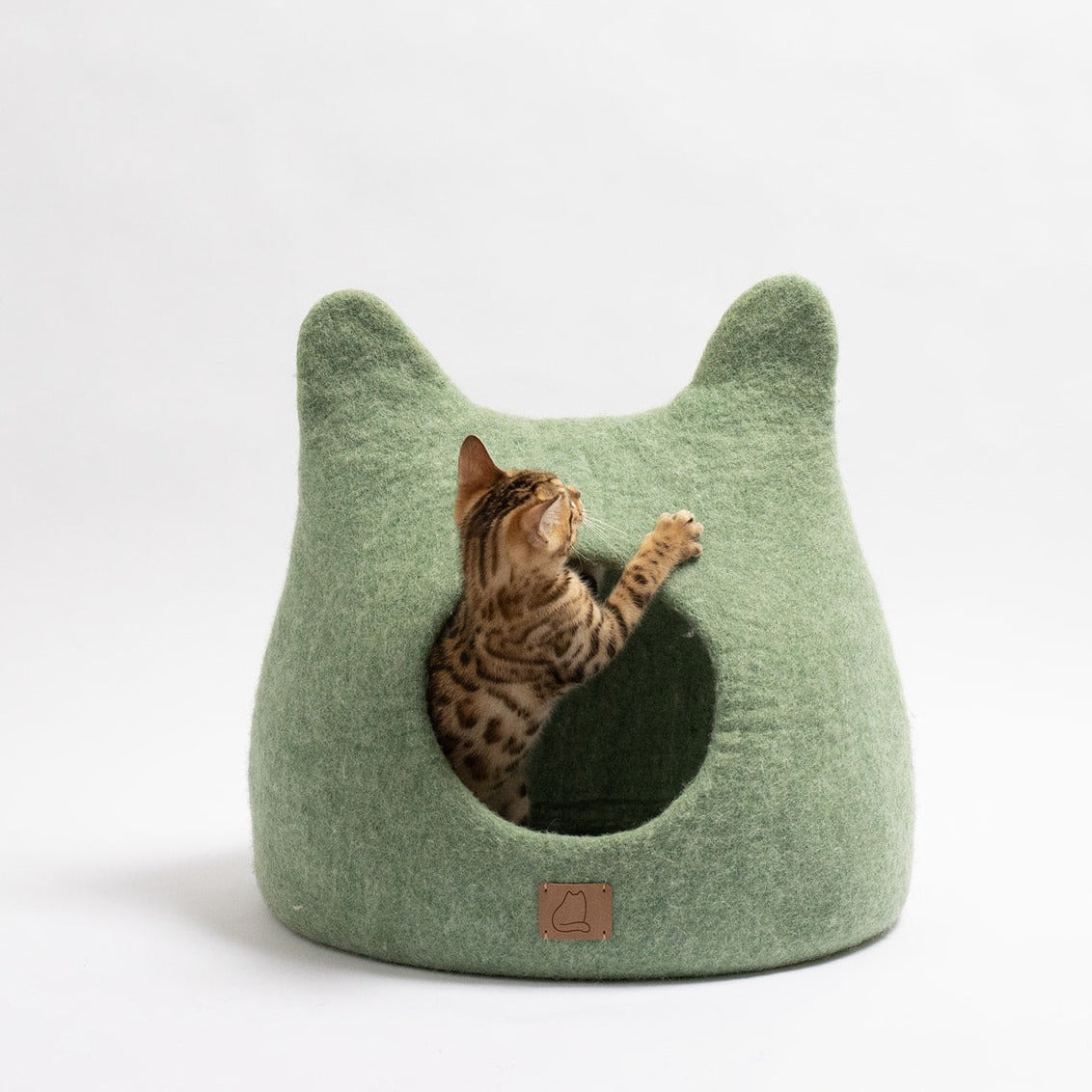 Eucalyptus Green Ear Style Cave made of premium felted wool, featuring a cozy peekaboo design for cats, blending elegance with comfort.