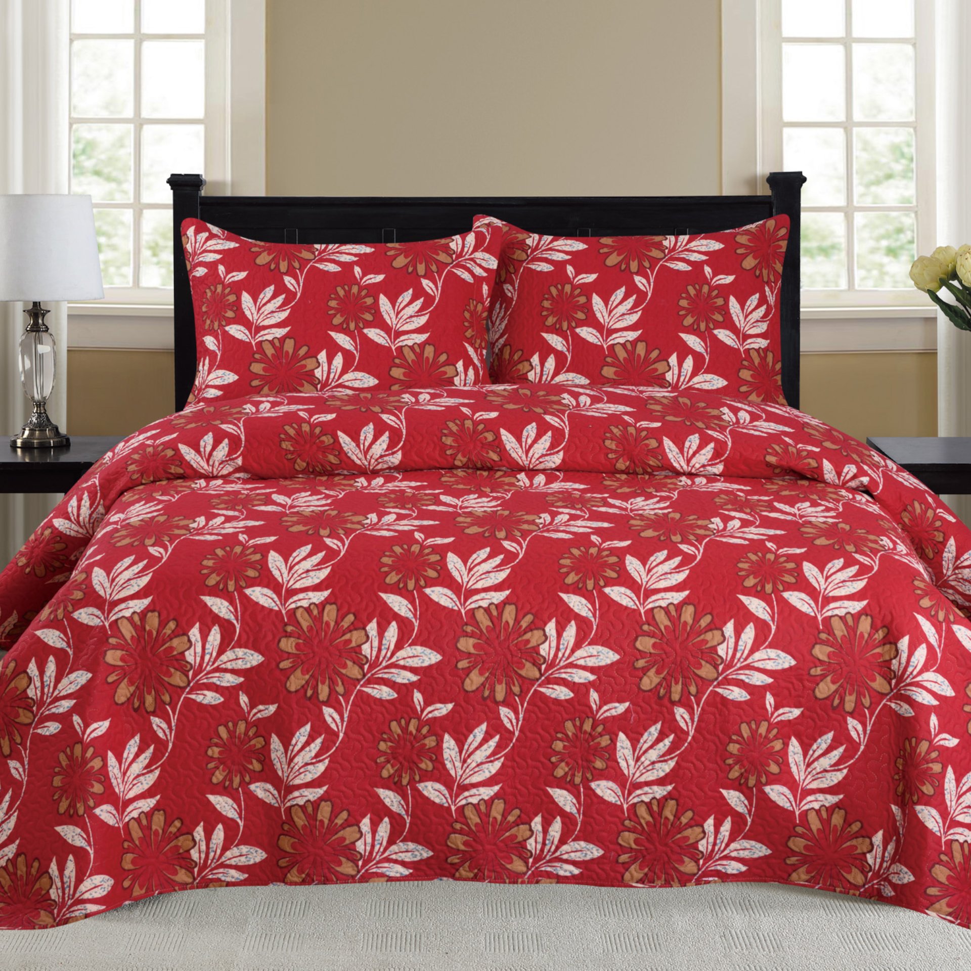 Nikki 3 Piece Quilt Set in vibrant red, featuring a cozy quilt and two matching pillow shams, displayed on a neatly made bed.