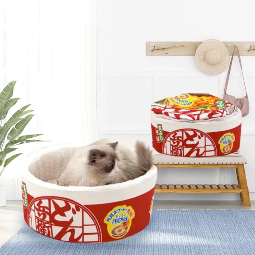A plush Pet Ramen Cushion Bed designed for pets, featuring a cute ramen bowl shape with soft cotton and polyester materials, perfect for cats and dogs.