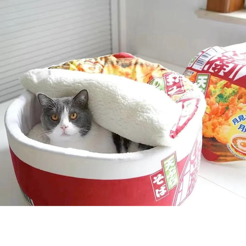A plush Pet Ramen Cushion Bed designed for pets, featuring a cute ramen bowl shape with soft cotton and polyester materials, perfect for cats and dogs.