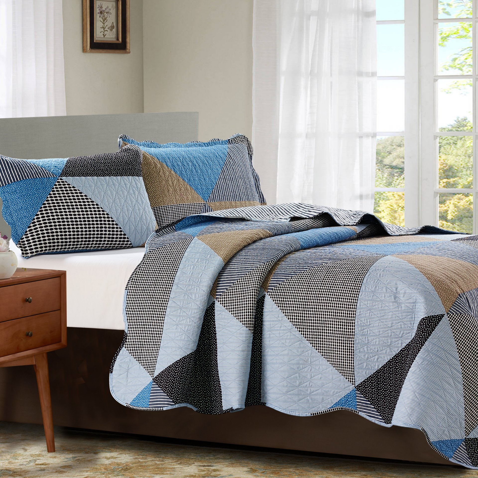 Suzy 3 Piece Quilt Set in Grey featuring a quilt and two matching pillow shams, elegantly displayed on a bed.