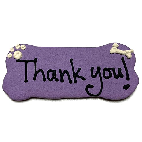 A pack of Custom Bones dog treats, personalized with text, featuring a yogurt coating and colorful vegetable coloring, perfect for dogs.