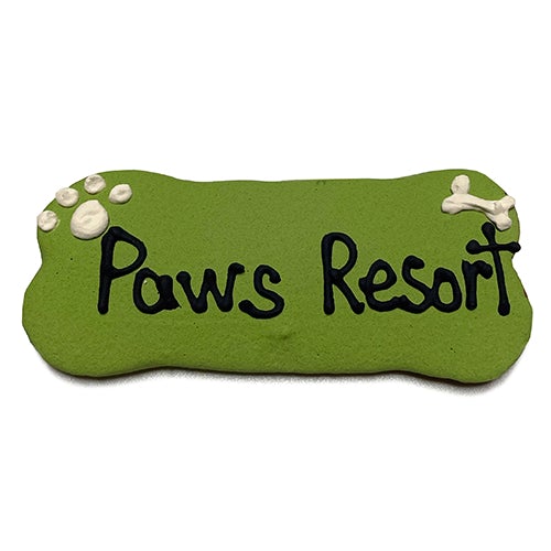 A pack of Custom Bones dog treats, personalized with text, featuring a yogurt coating and colorful vegetable coloring, perfect for dogs.