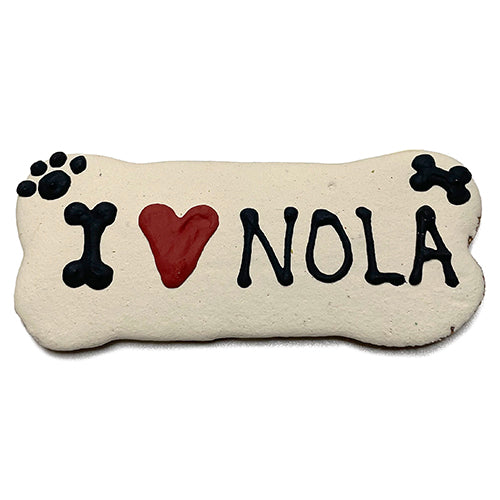 A pack of Custom Bones dog treats, personalized with text, featuring a yogurt coating and colorful vegetable coloring, perfect for dogs.