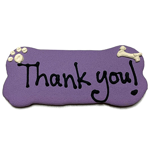 A pack of Custom Bones dog treats, personalized with text, featuring a yogurt coating and colorful vegetable coloring, perfect for dogs.