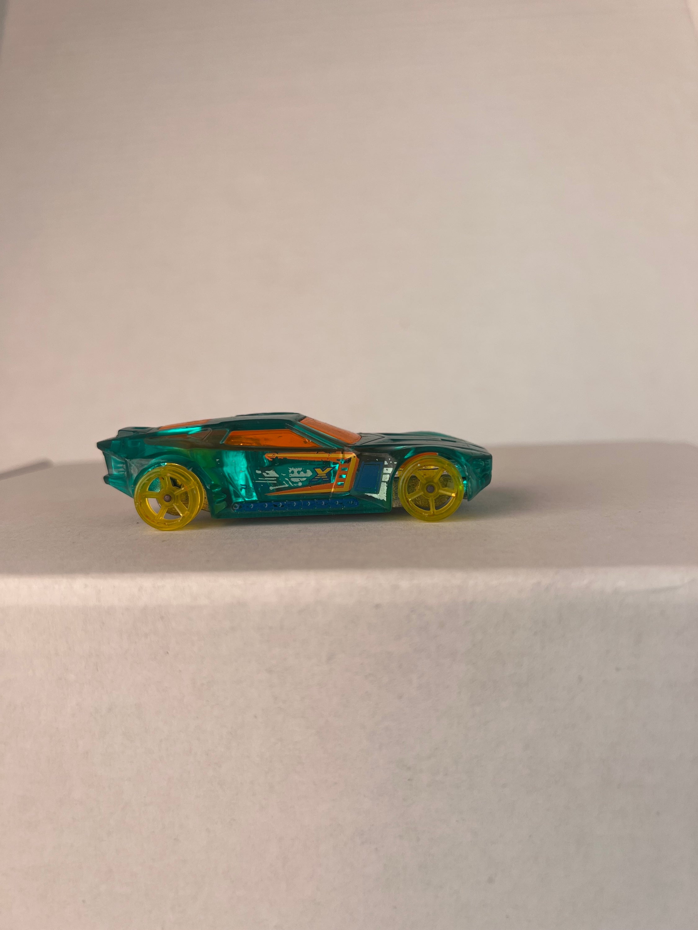 Hot Wheels Bullet Proof X-Raycers die-cast car in aqua color, showcasing its unique design and details.