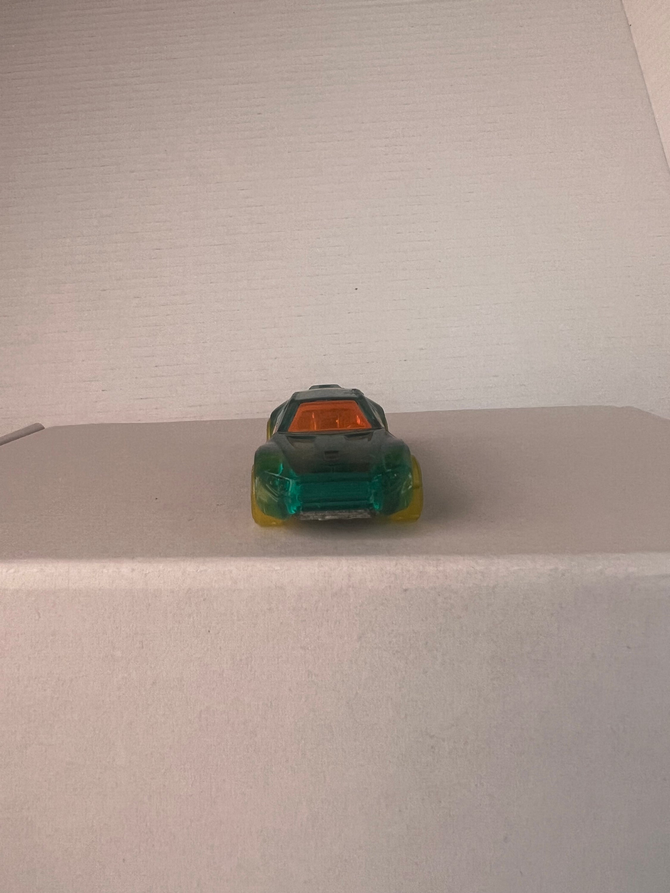 Hot Wheels Bullet Proof X-Raycers die-cast car in aqua color, showcasing its unique design and details.