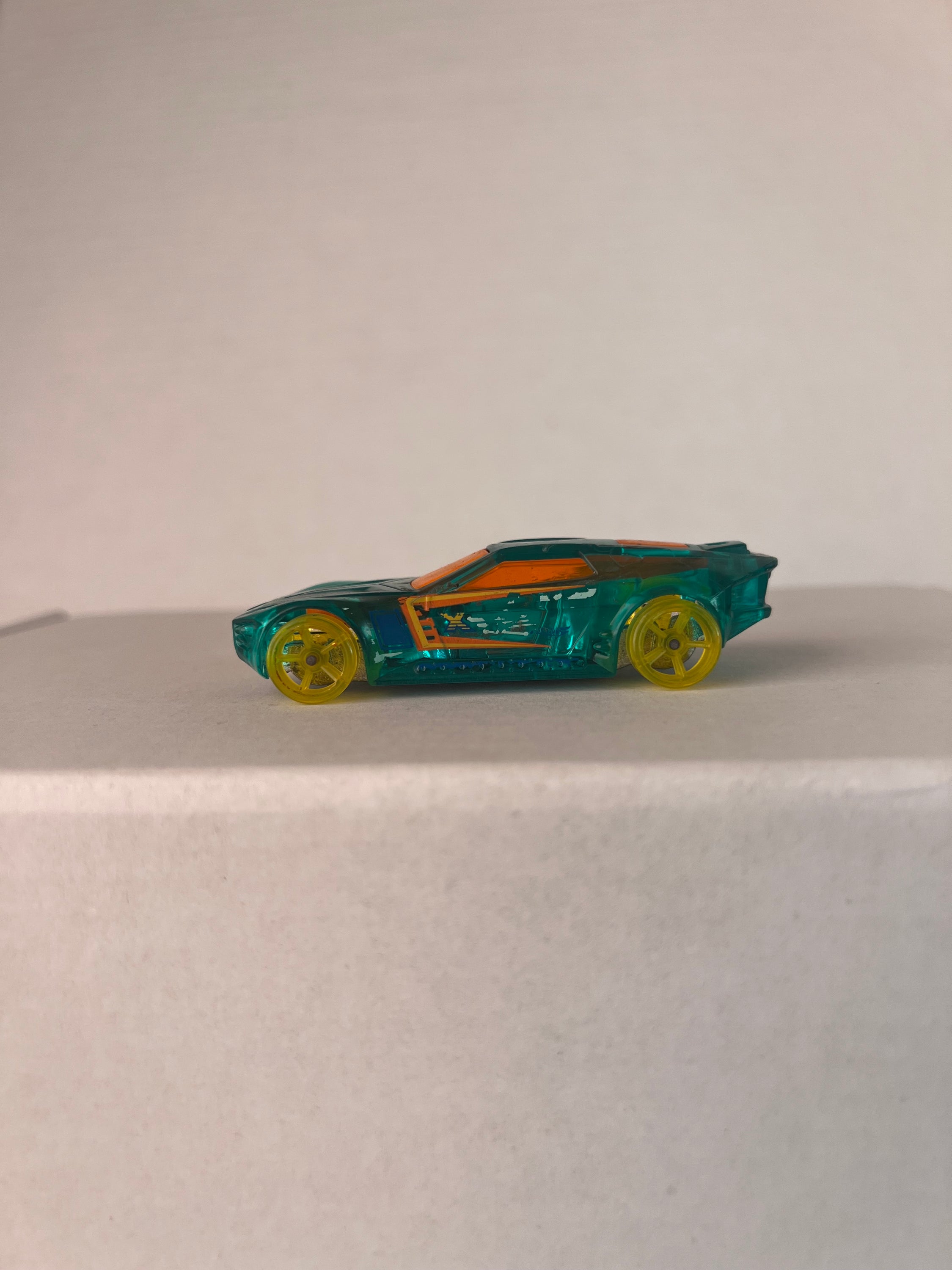 Hot Wheels Bullet Proof X-Raycers die-cast car in aqua color, showcasing its unique design and details.