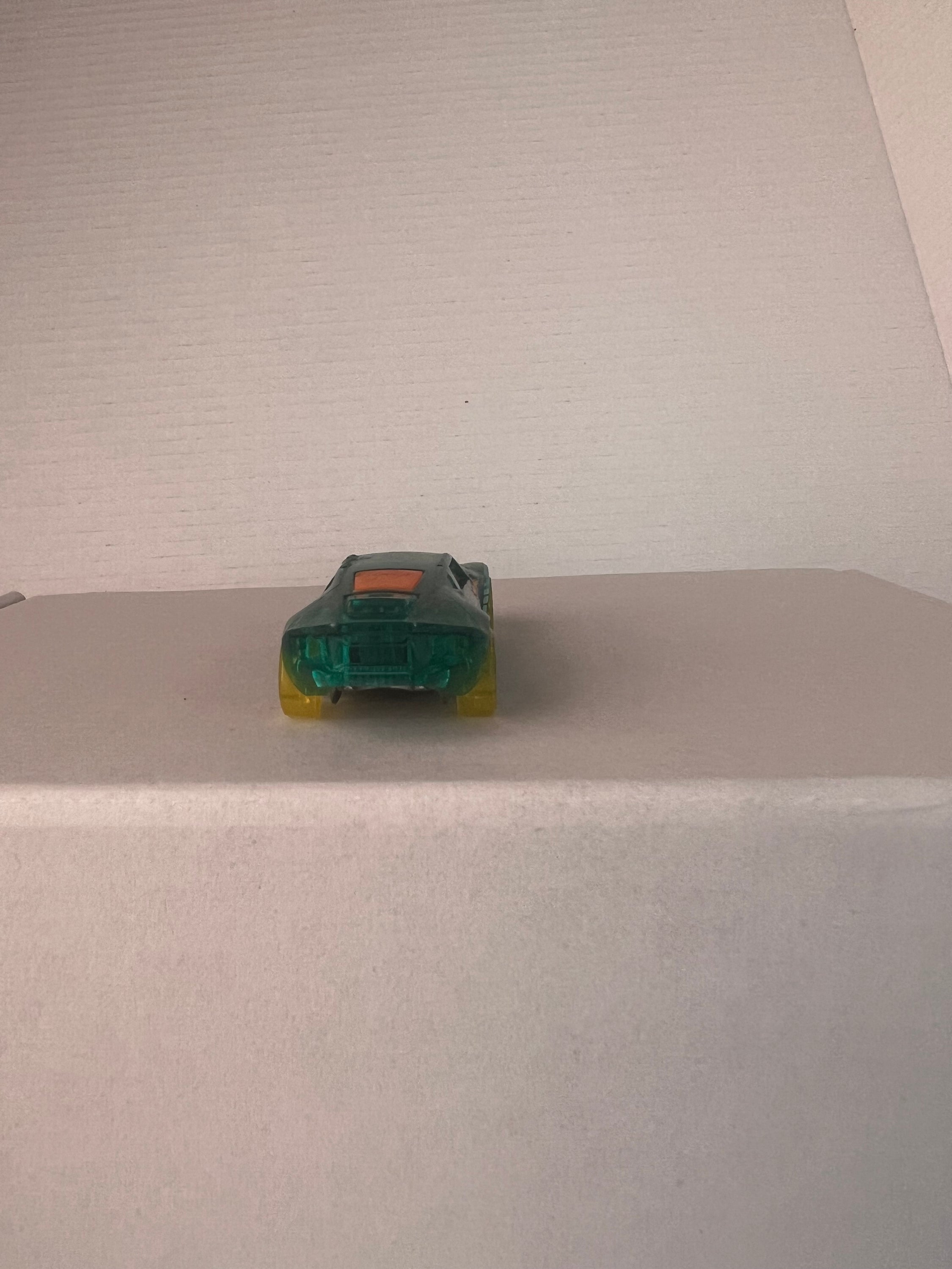 Hot Wheels Bullet Proof X-Raycers die-cast car in aqua color, showcasing its unique design and details.