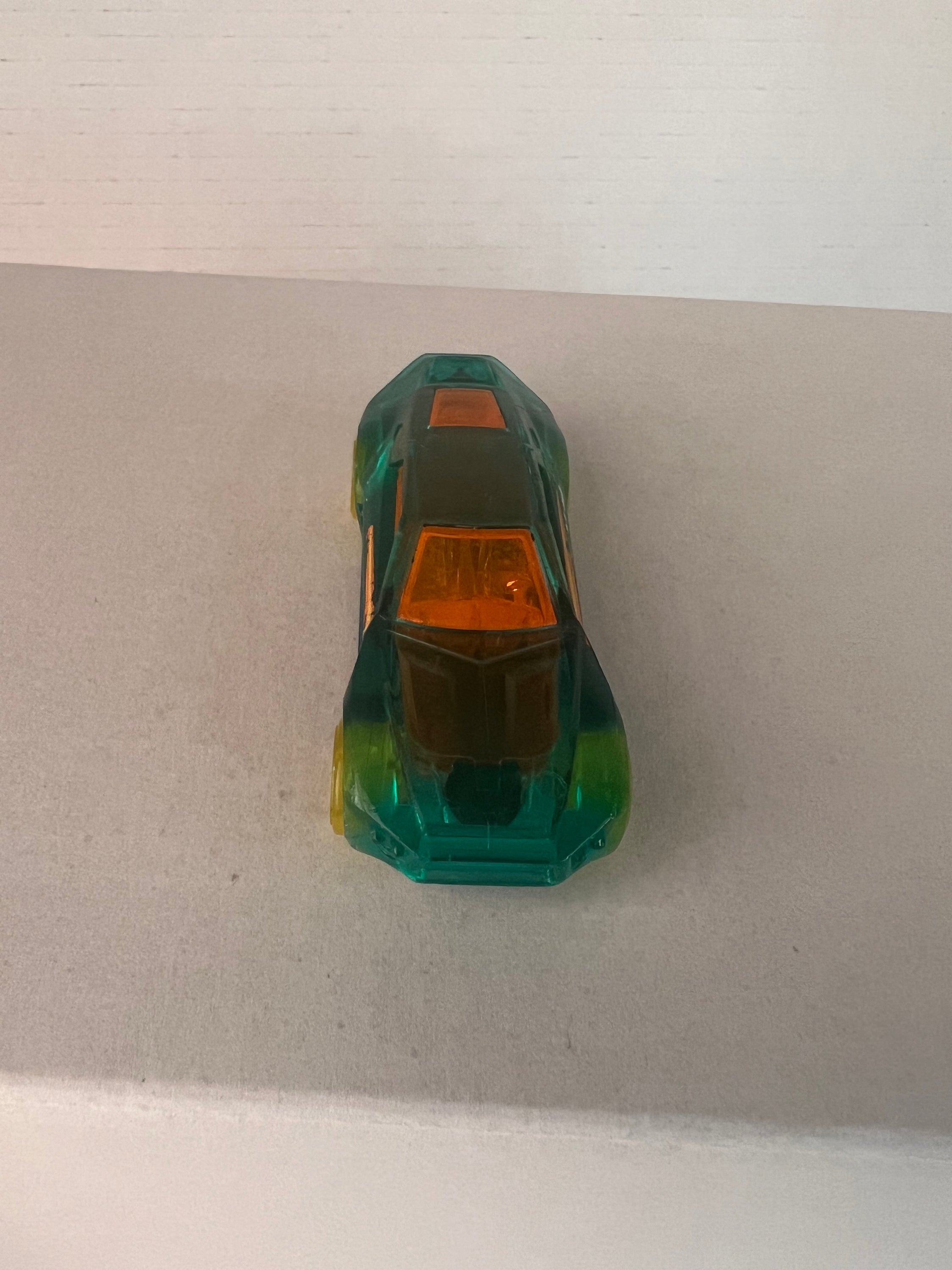 Hot Wheels Bullet Proof X-Raycers die-cast car in aqua color, showcasing its unique design and details.