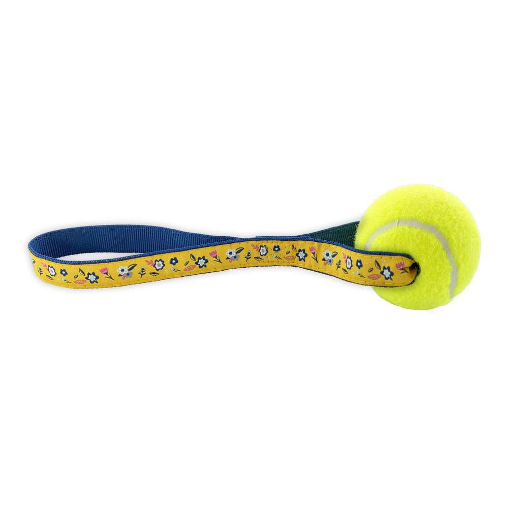 A colorful Sunshine Floral Tennis Ball Toss Toy featuring a durable nylon loop handle and a non-pressurized Tuff Ball, perfect for interactive play with dogs.
