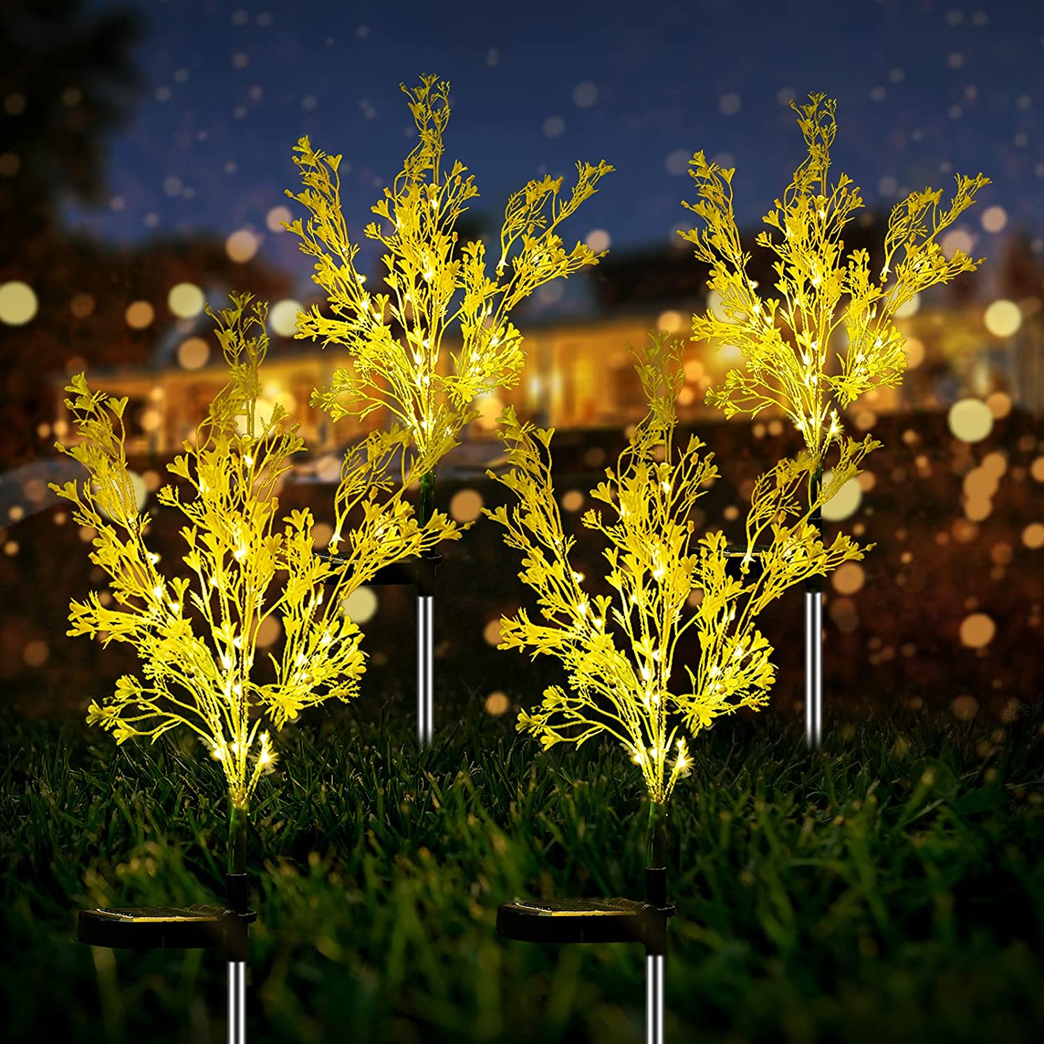 Two solar-powered canola flower shape lights glowing in a garden at night, showcasing their vibrant yellow color and realistic flower design.