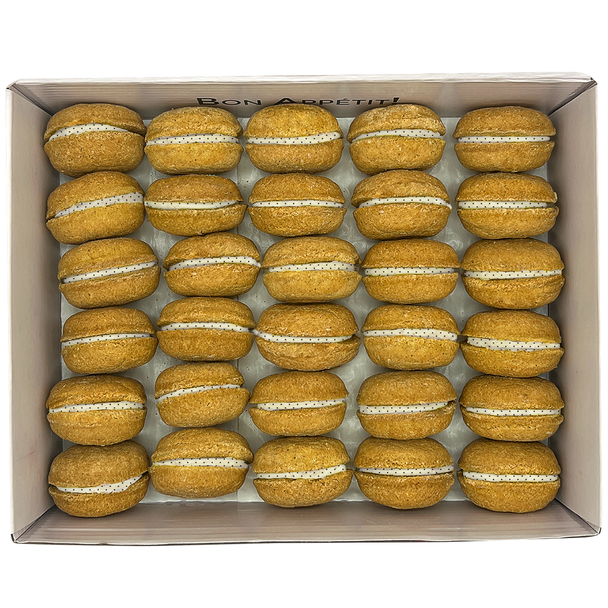 A colorful assortment of 40 dog macarons in a non-branded plastic tube, showcasing their appealing design and natural ingredients.
