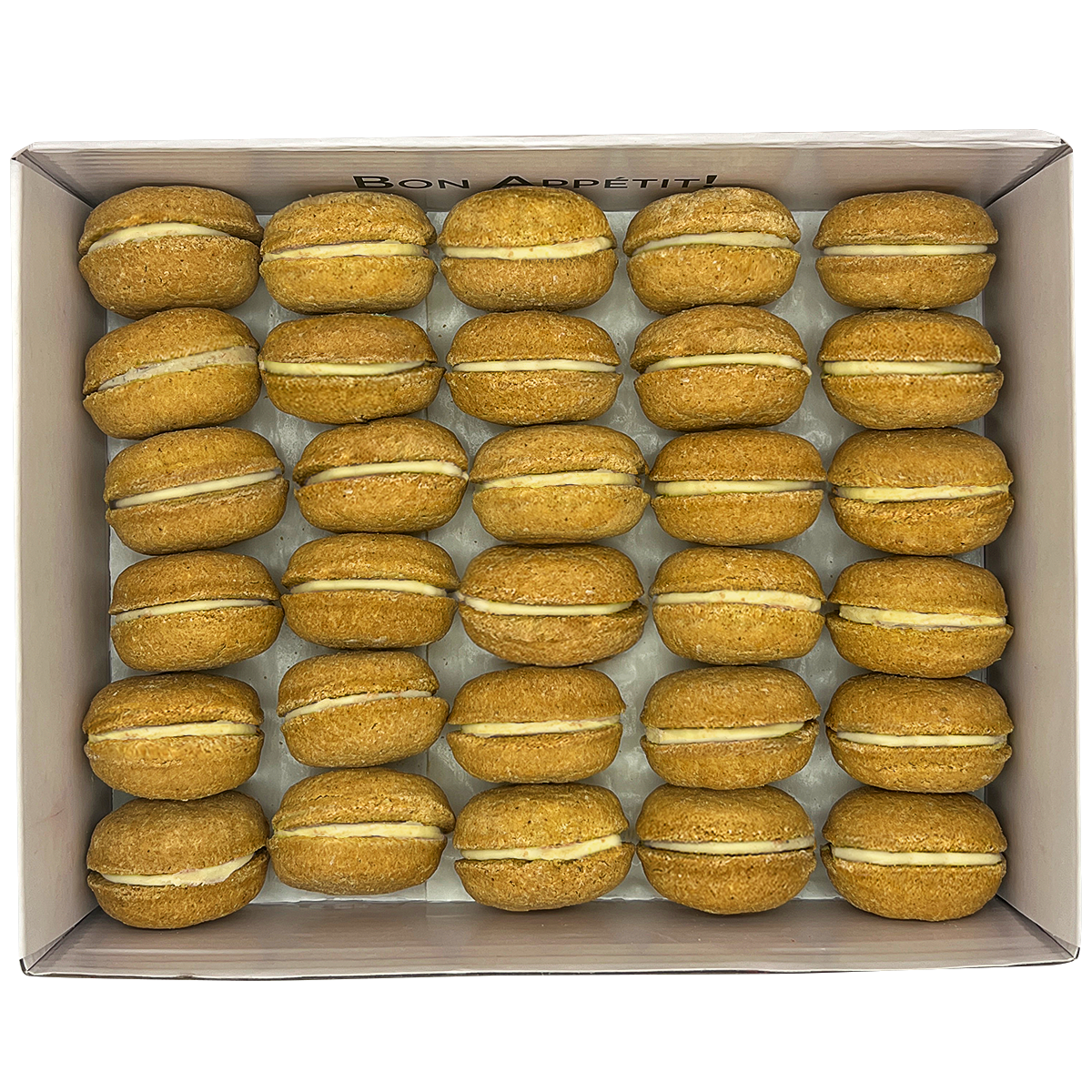A colorful assortment of 40 dog macarons in a non-branded plastic tube, showcasing their appealing design and natural ingredients.