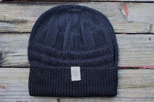 Adventure Required Hillary Alpaca Hat, hand-knit from 100% baby alpaca wool, showcasing unique patterns and textures.