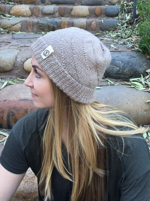 Kingsley Alpaca Hat made from 100% baby alpaca wool, hand-knit by Quechua artisans in Peru, featuring a stylish design for warmth and comfort.